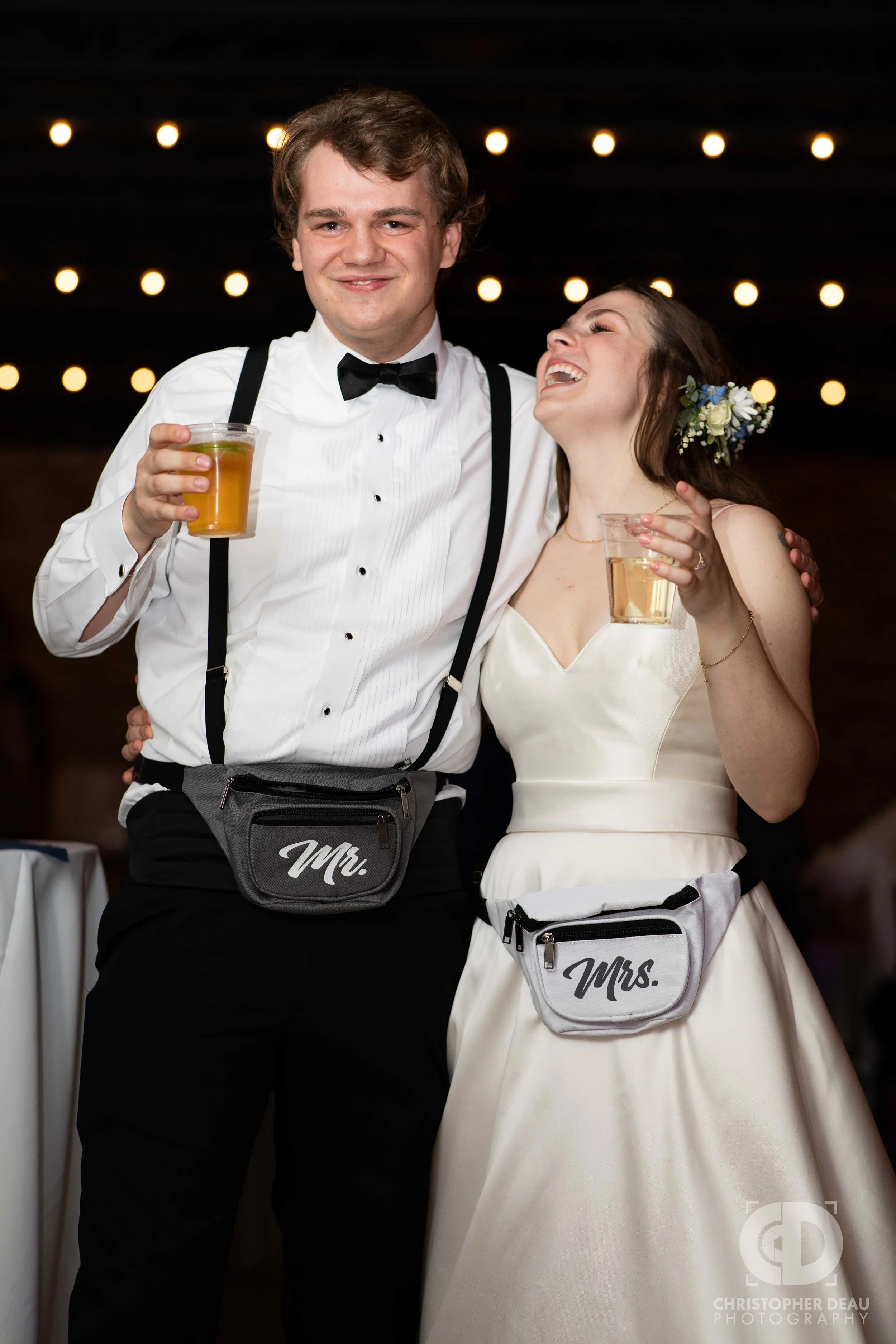 bride and groom wearing fanny packs