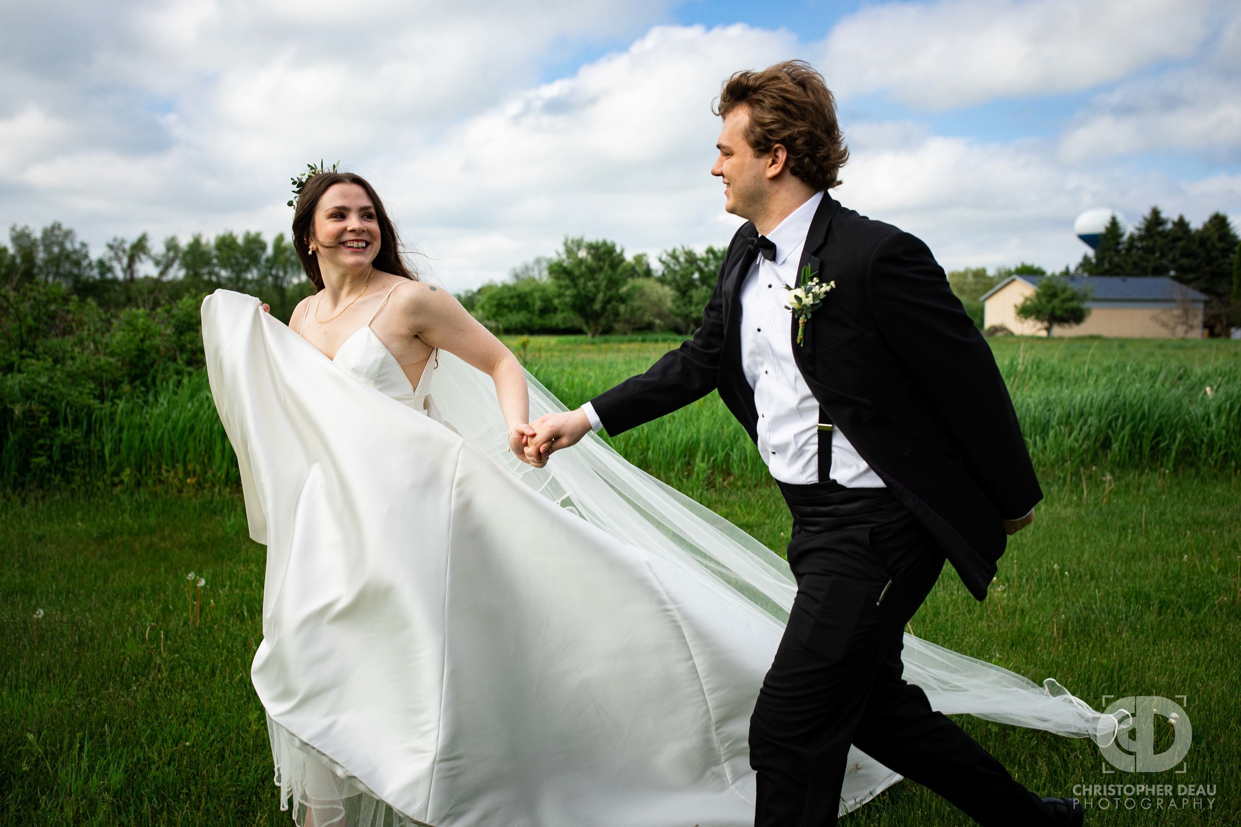  bride and groom running and laughing 