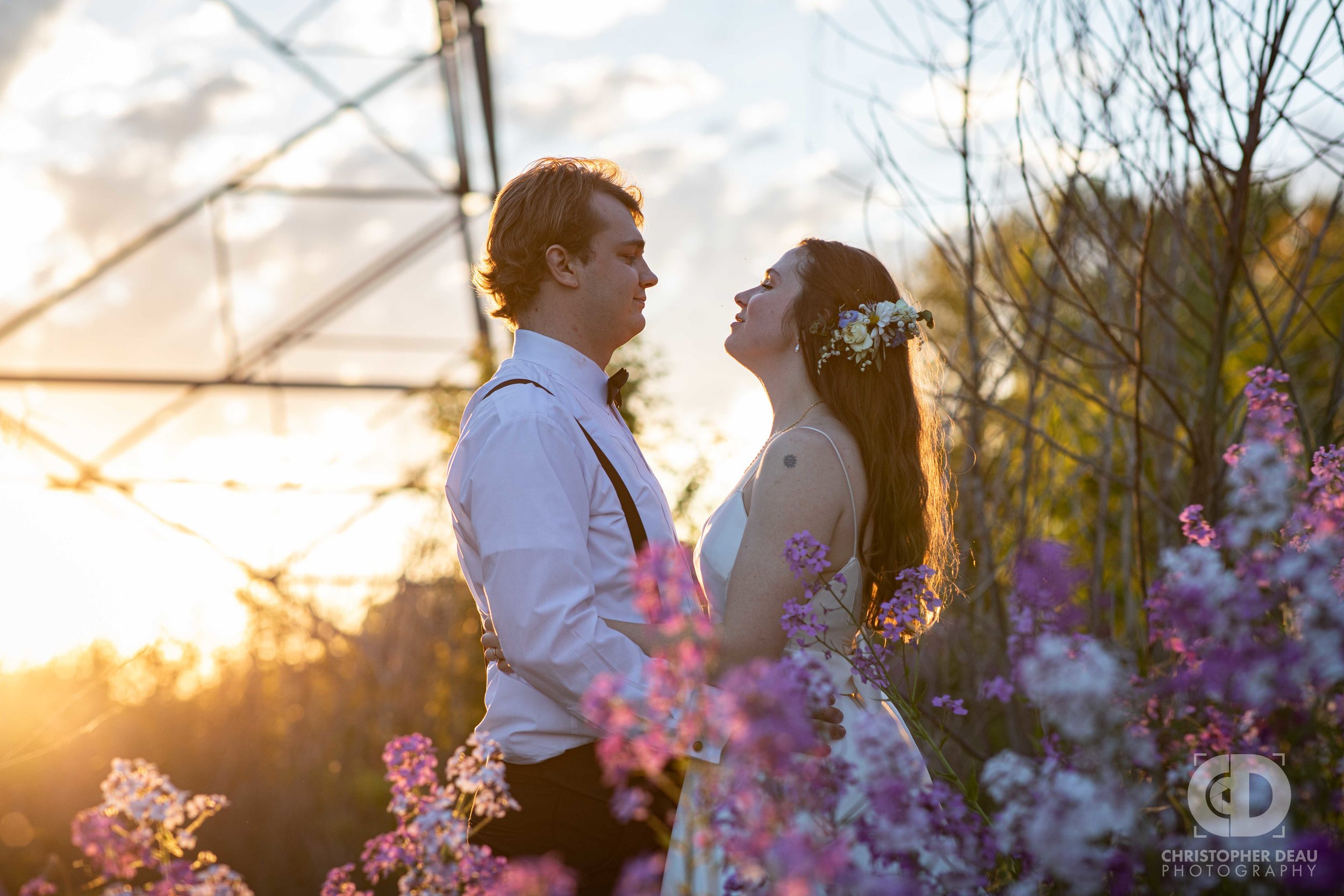  bride and groom wildflowers and sunset 