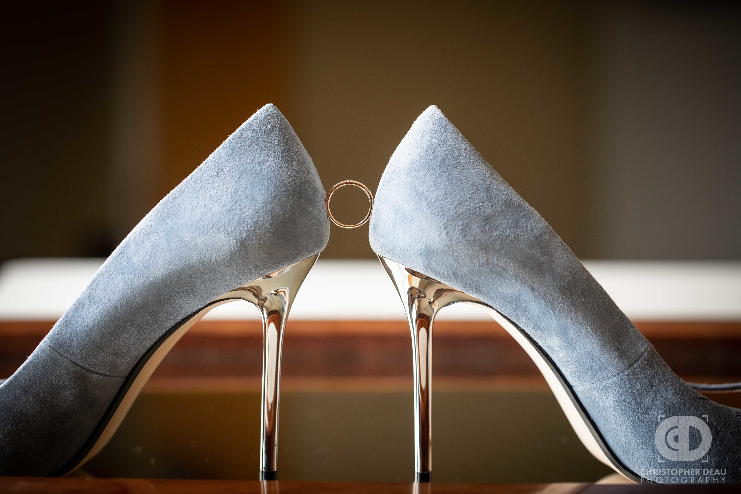  wedding ring wedged between shoes 