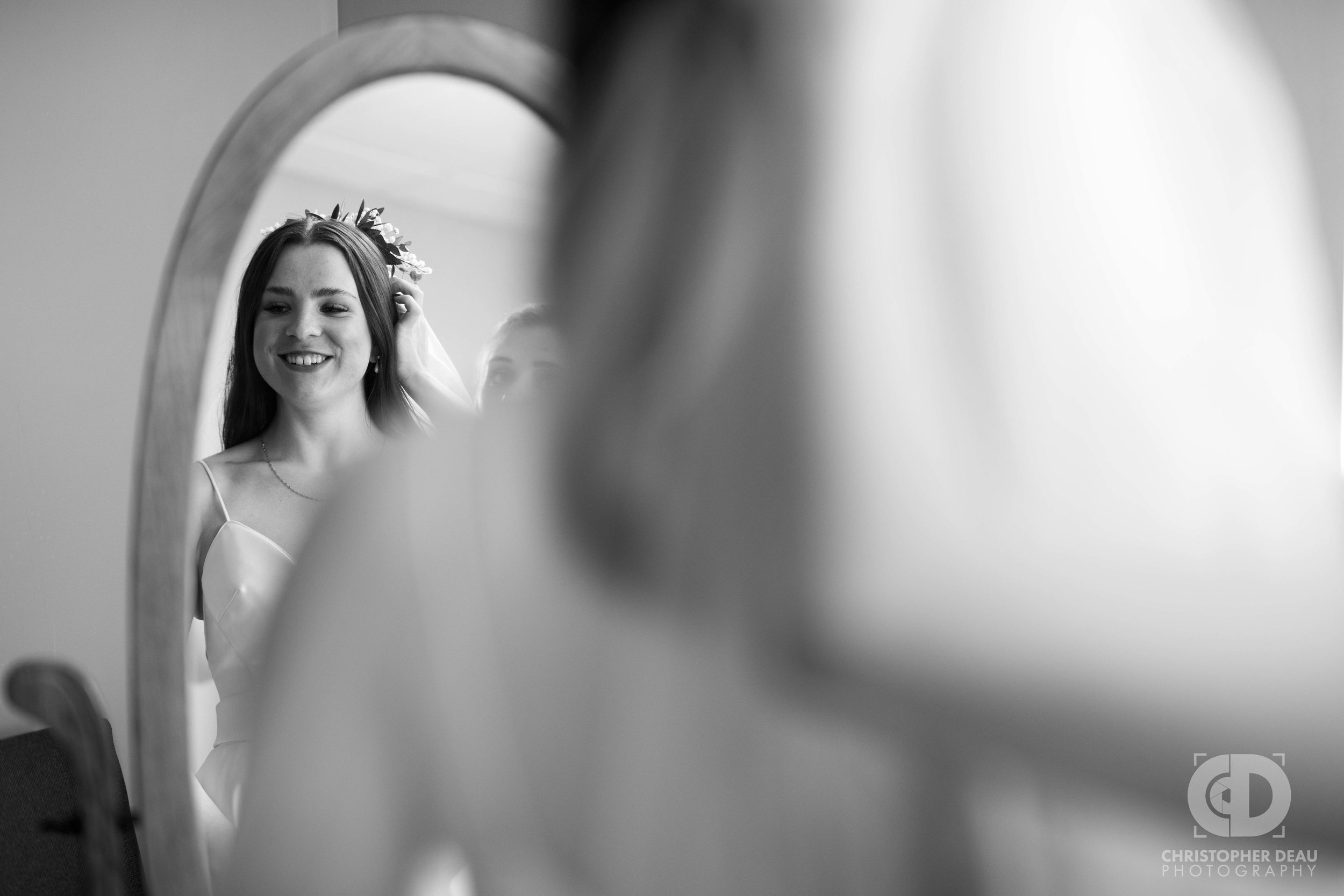  bride looking in mirror 