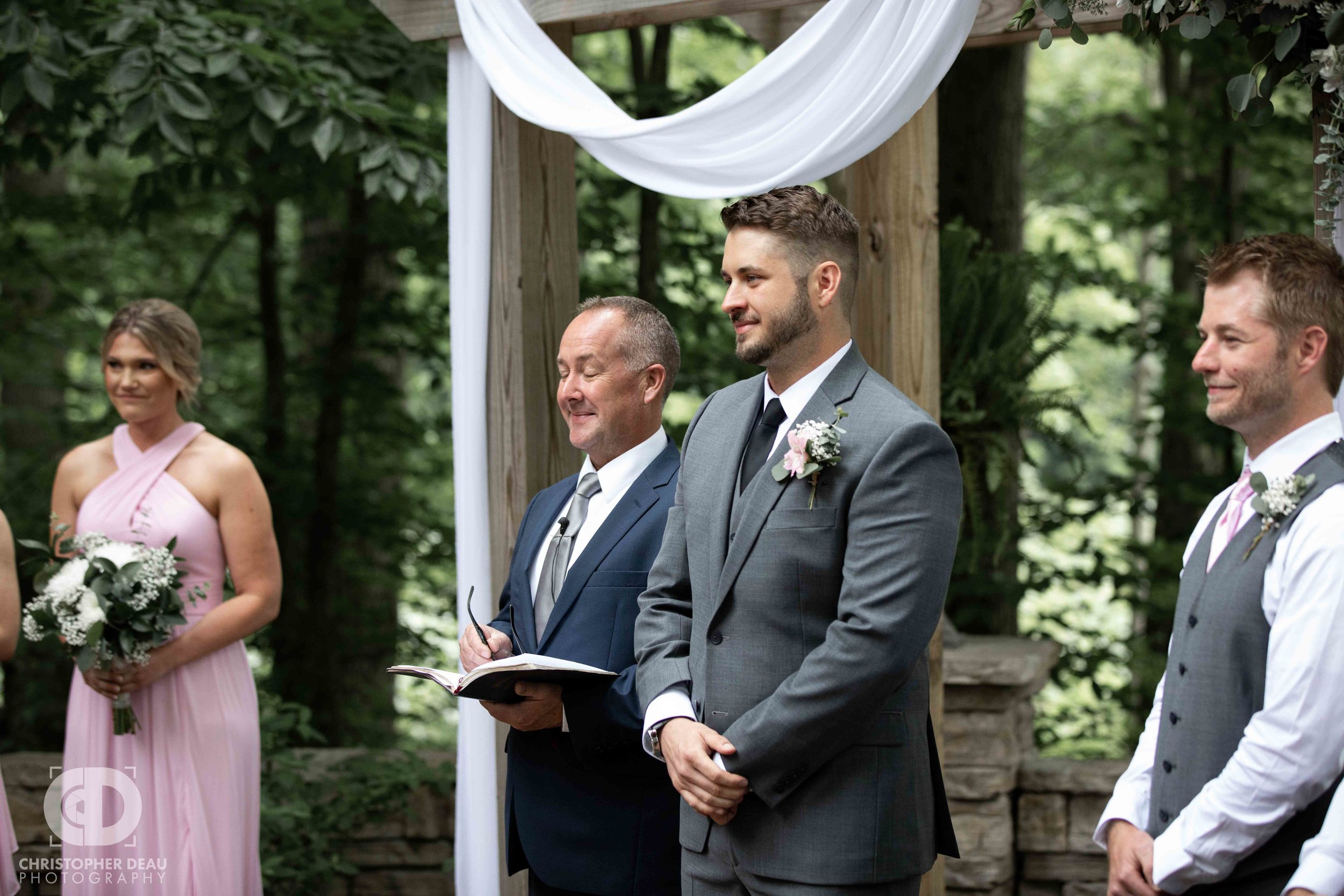  groom waiting for his bride during the ceremony 