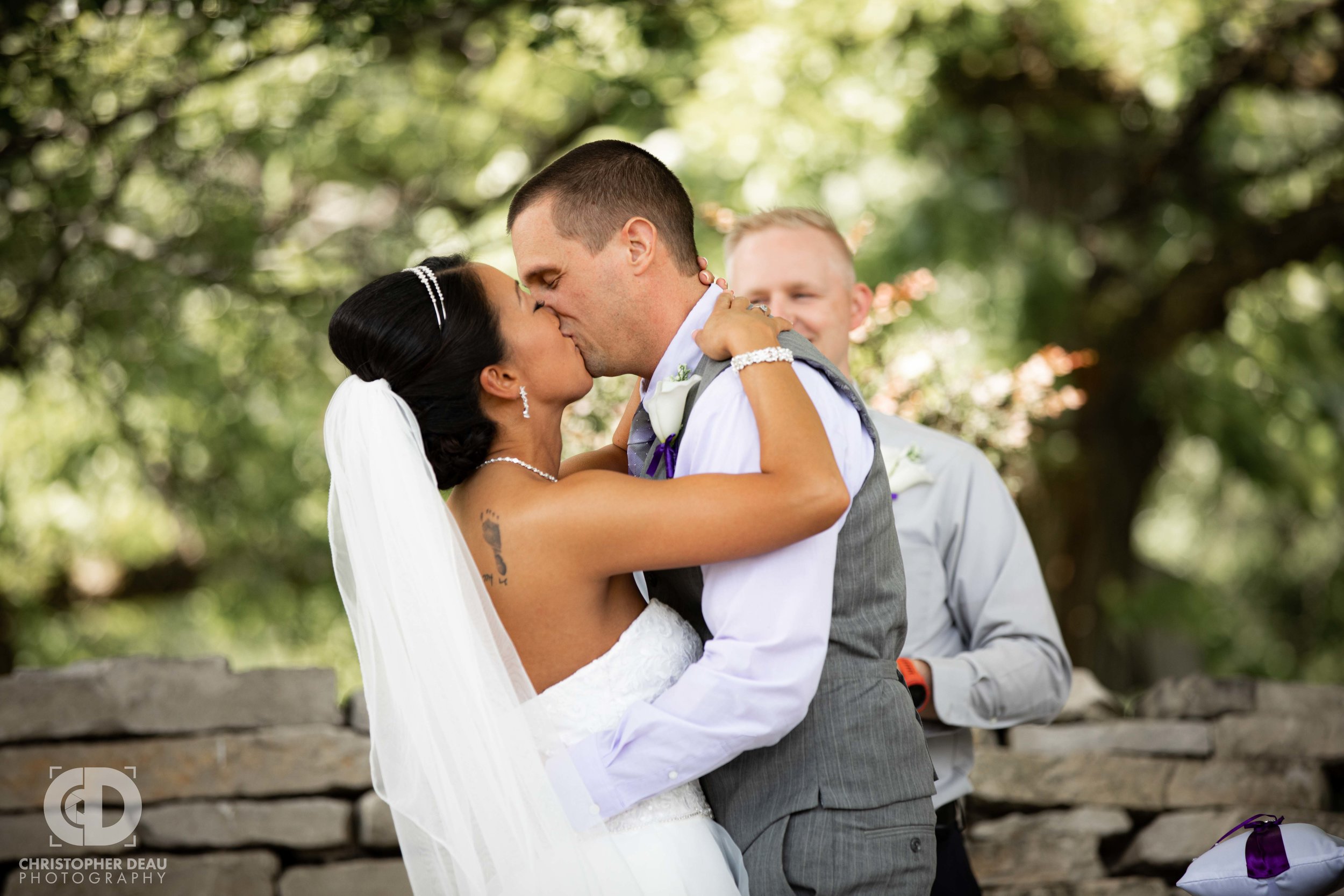  First Kiss at wedding ceremony in Portage Michigan 