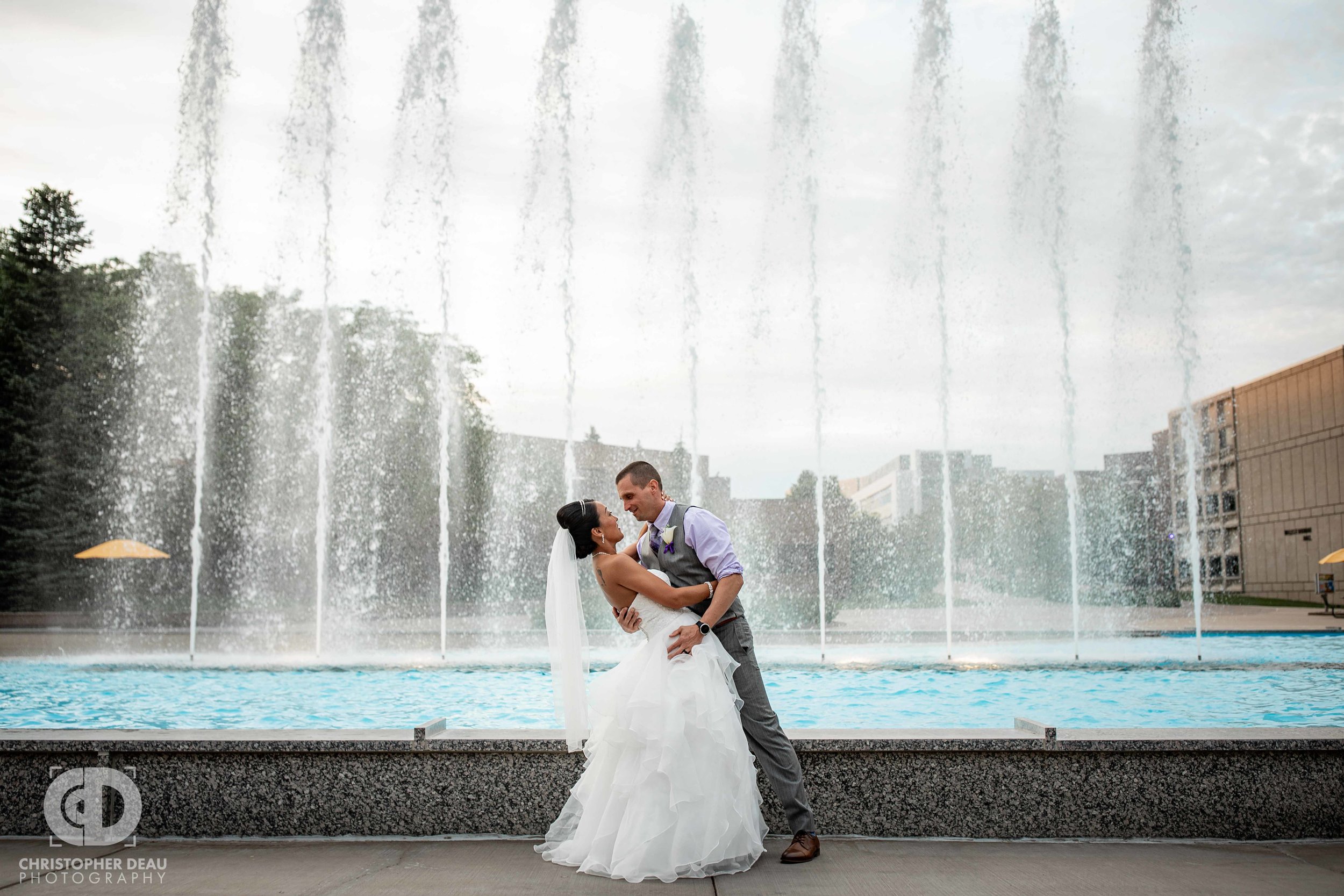  Bride and Groom in front of fountains at WMU Miller Auditorium  