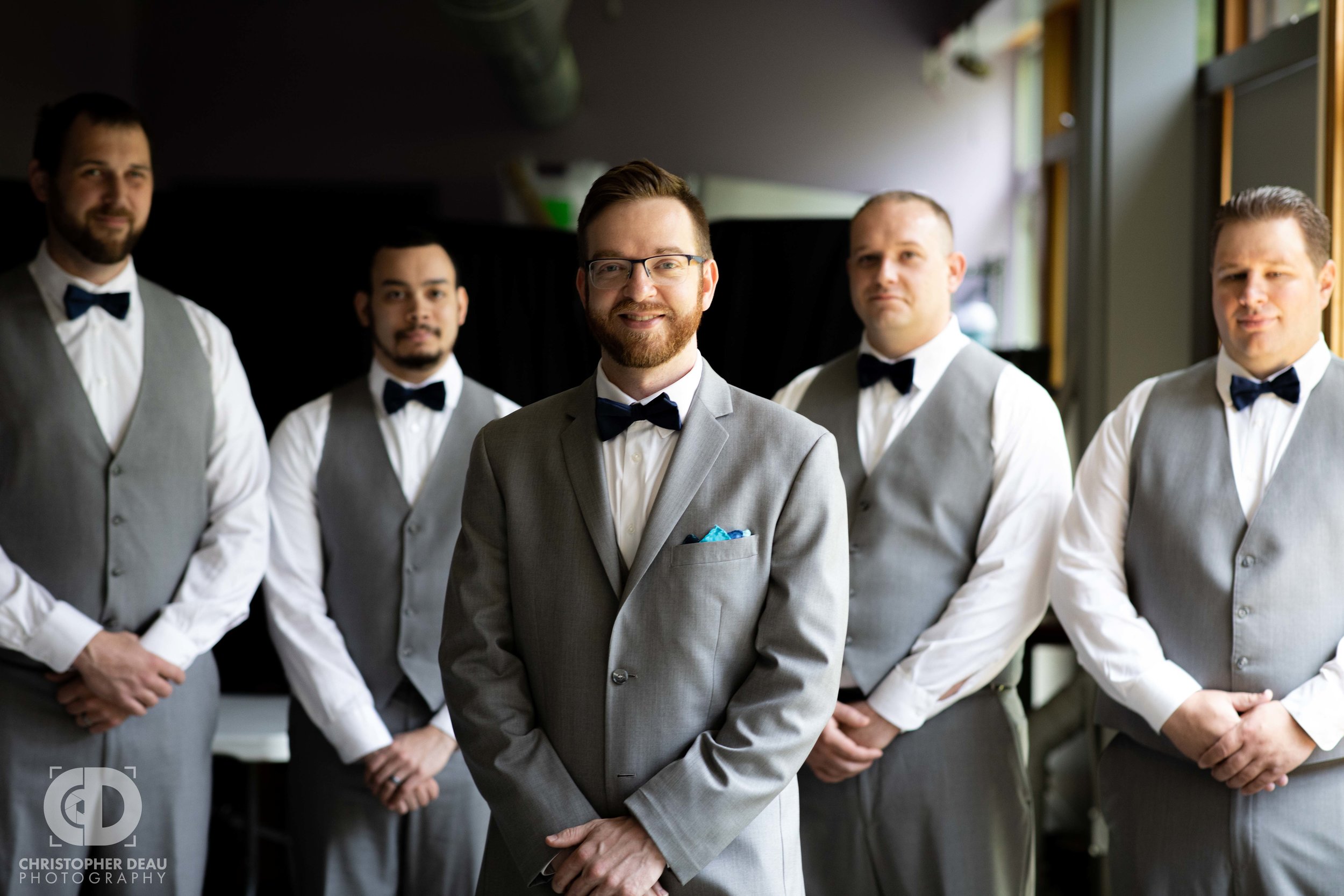  groom with his groomsmen in great lighting 