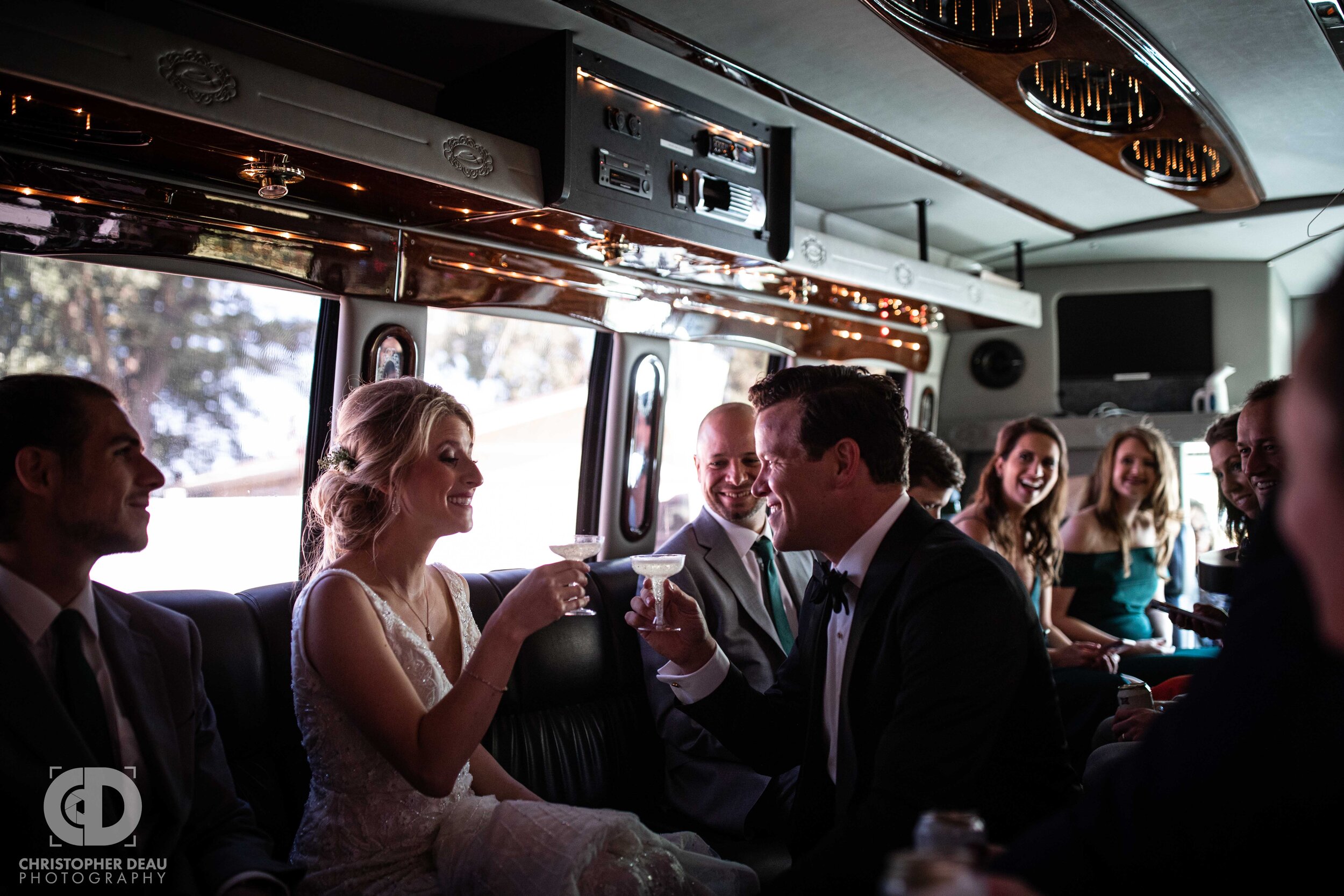  bride and groom toast on the party bus 