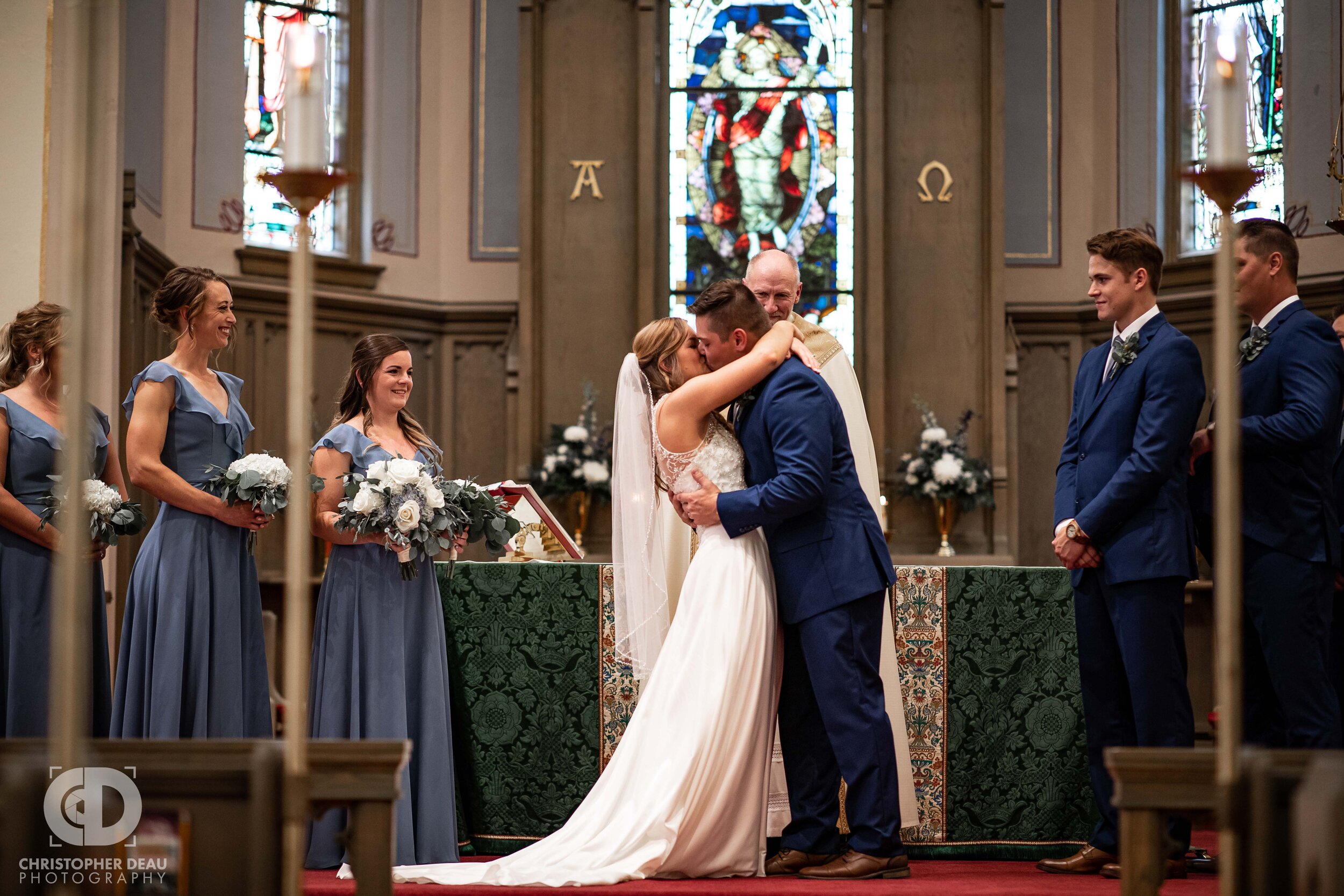  Bride and Groom first kiss at Trinity Lutheran Church in Kalamazoo, MI 