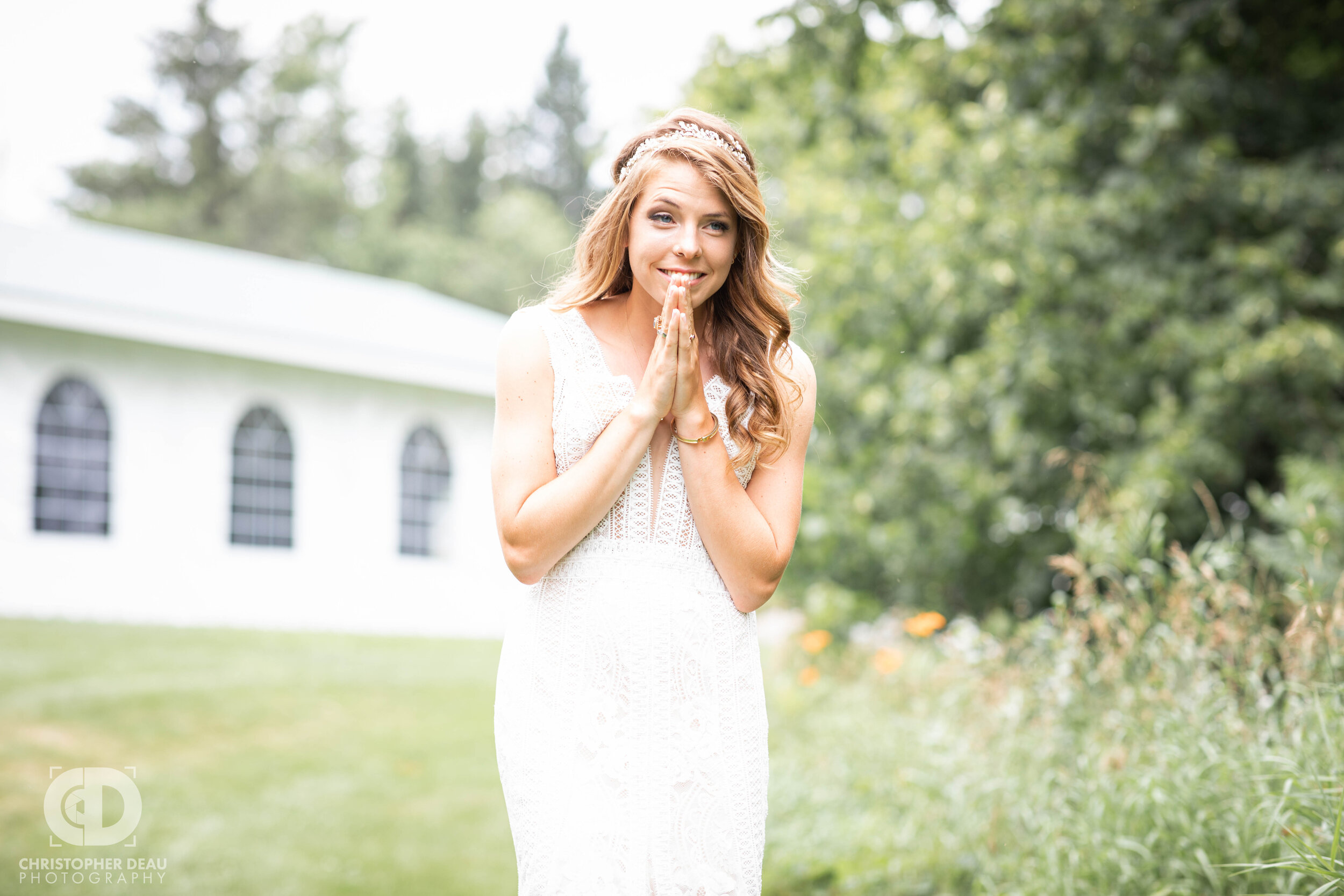  bride laughs in excitement as she walks toward the groom for their first look 