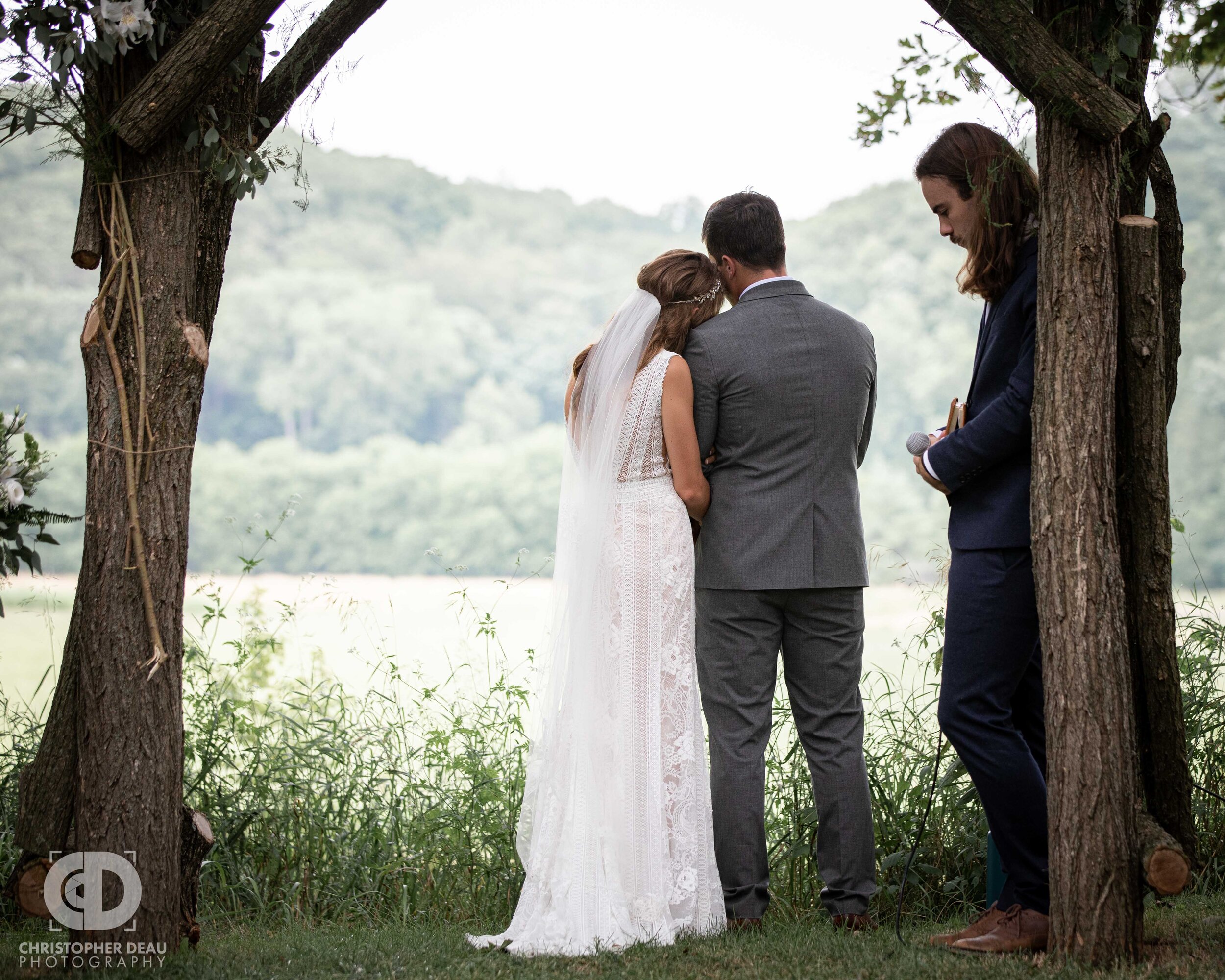  Bride and groom take a moment to reflect during their wedding ceremony 