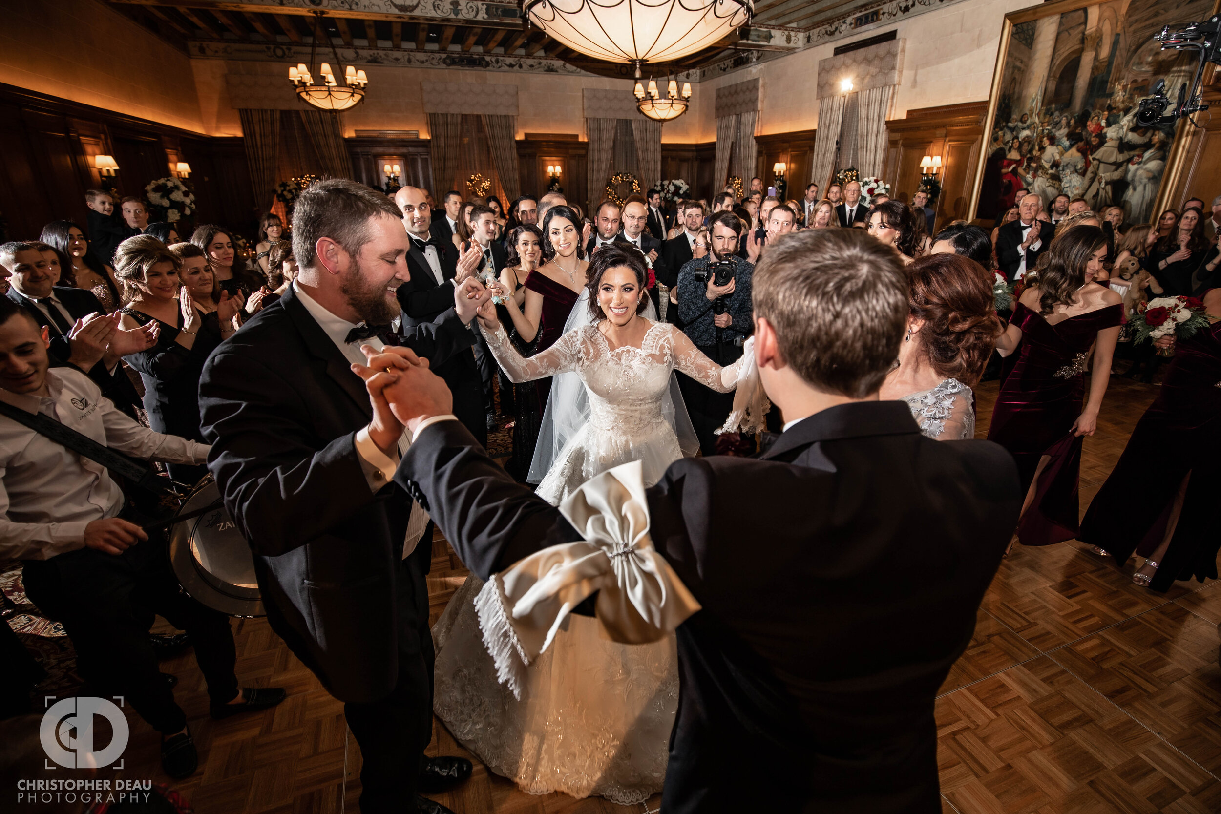 The bride and groom dance with their family and guests during the Chaldean Zaffa ceremony 