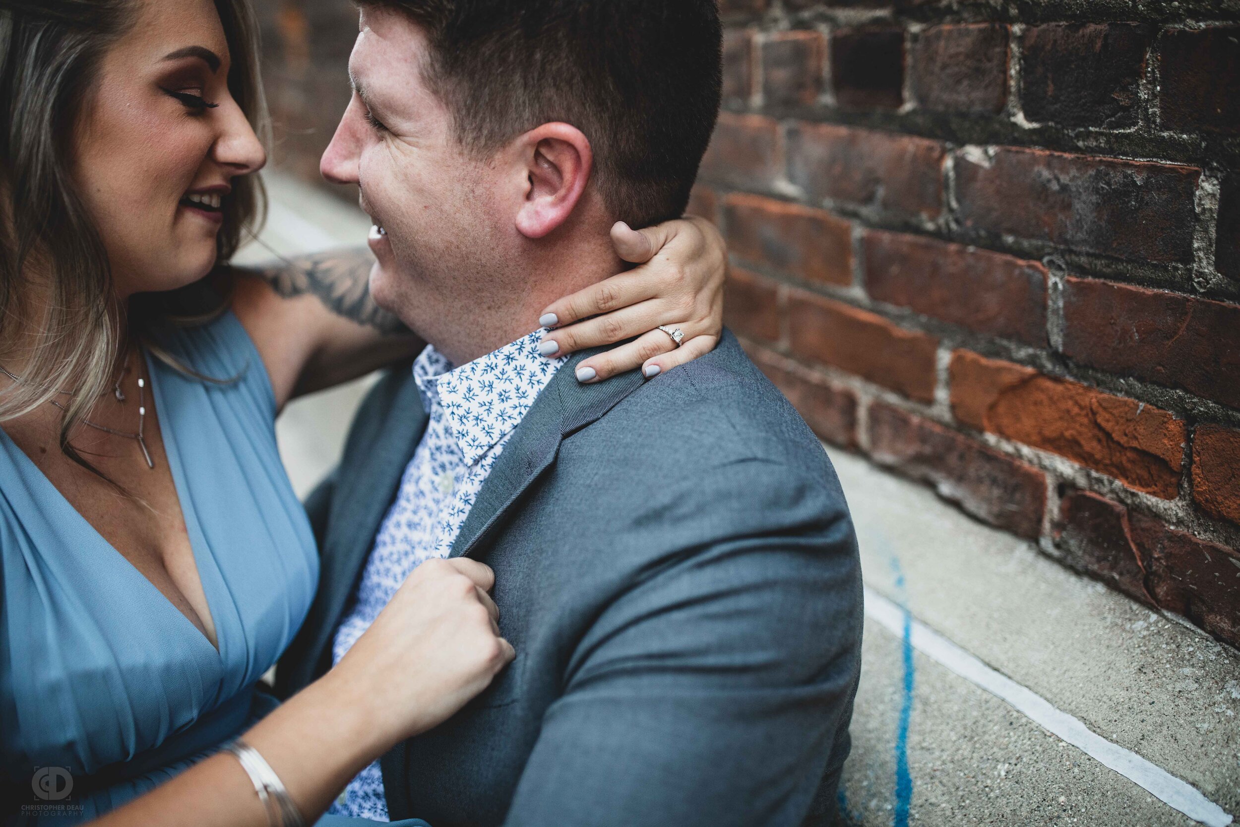 a couple sitting together in a downtown alley.jpg