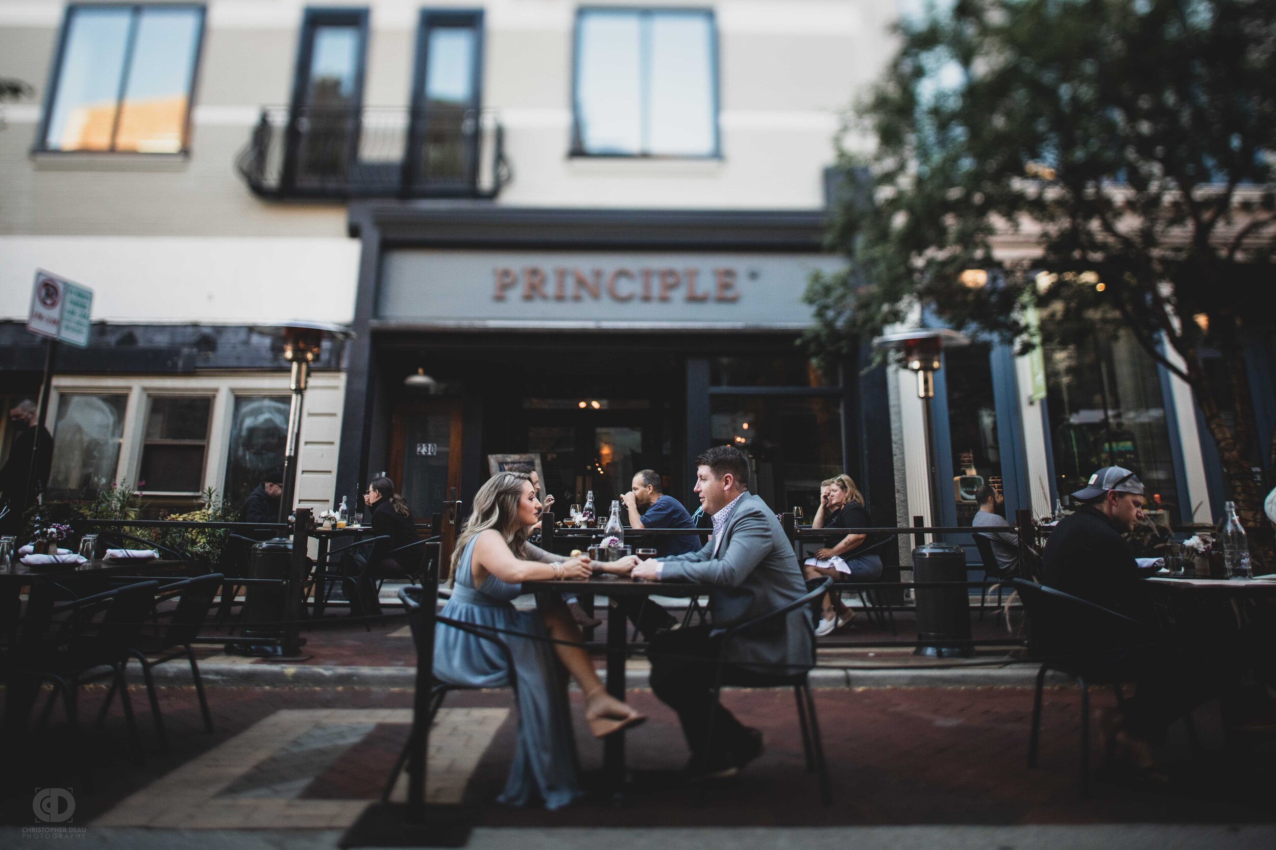 A couple enjoying a drink in front of a restaurant.jpg