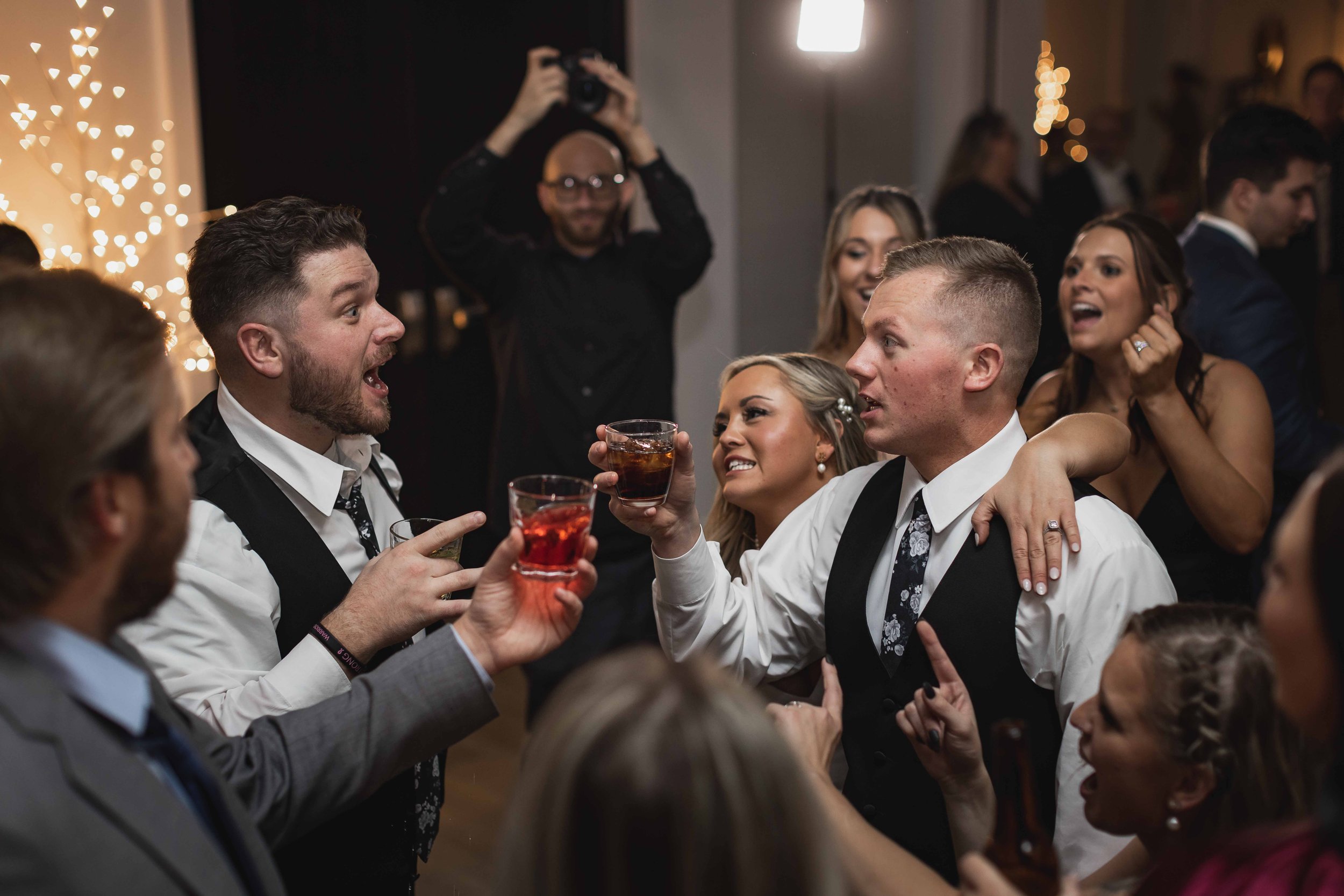Bride and groom dancing with wedding party.jpg