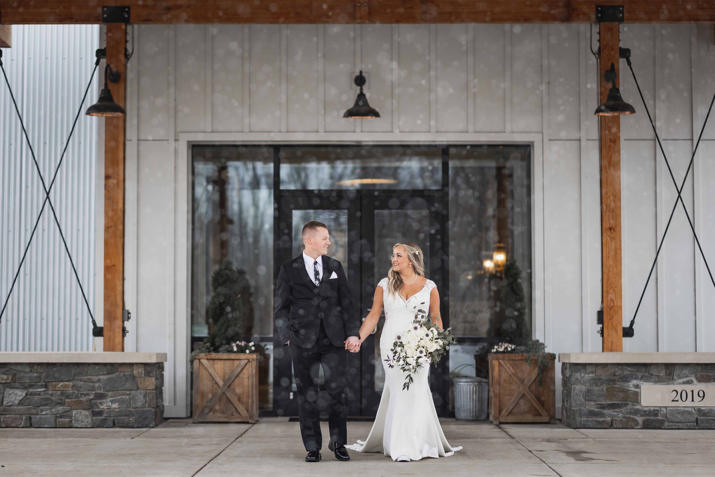 Bride and Groom Walking holding hands.jpg