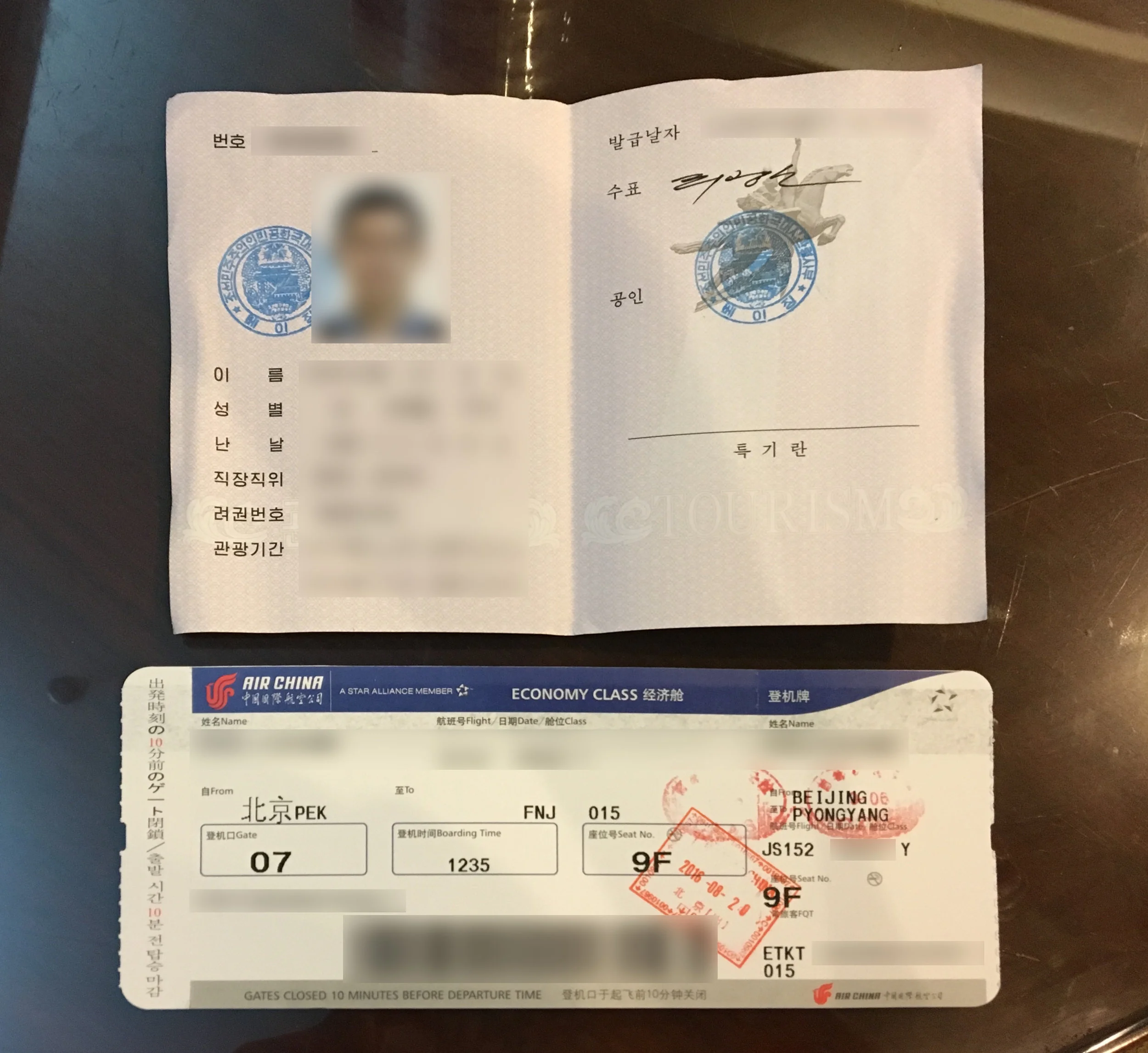 DPRK tourist visa card and Air Koryo boarding pass