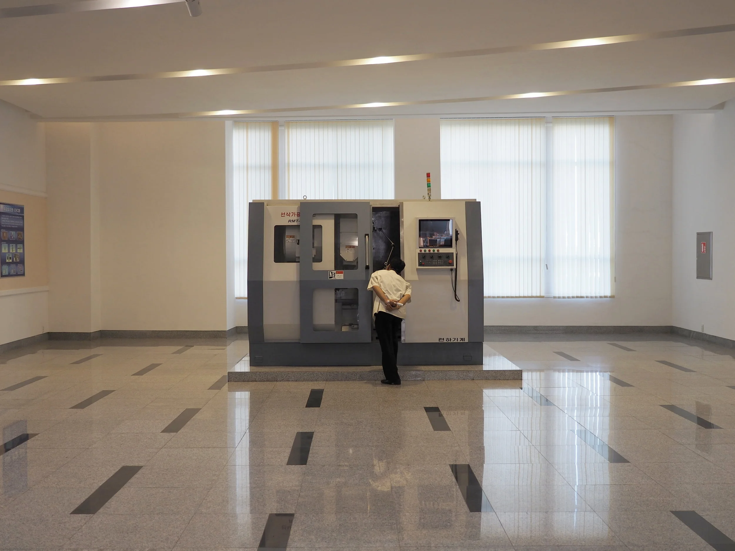  Visitor checks out the CNC machine 