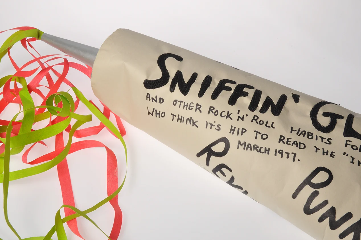homage to the 1970's punk zine 'Sniffin Glue', supersize paper glue tube, paper, card, acrylic paint and stitch. 80cm x 25cm x 20cm.