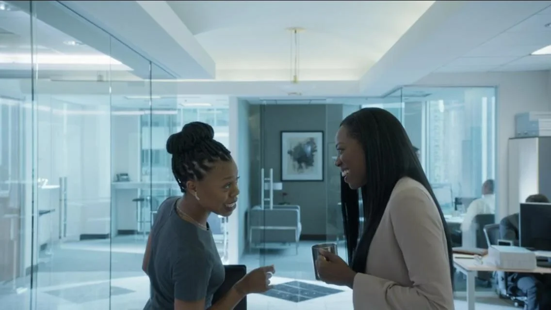 Molly and Rasheeda sharing a moment in the office. Photo credit: Insecure HBO 