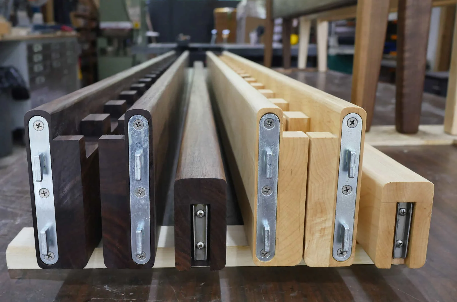  The side rails are massive pieces of solid hardwood with integrated slat pockets to keep everything tight and sturdy.  The center support is a big chunk of matching solid hardwood as well.  Depending on the spec, frames can weigh up to 150 pounds or