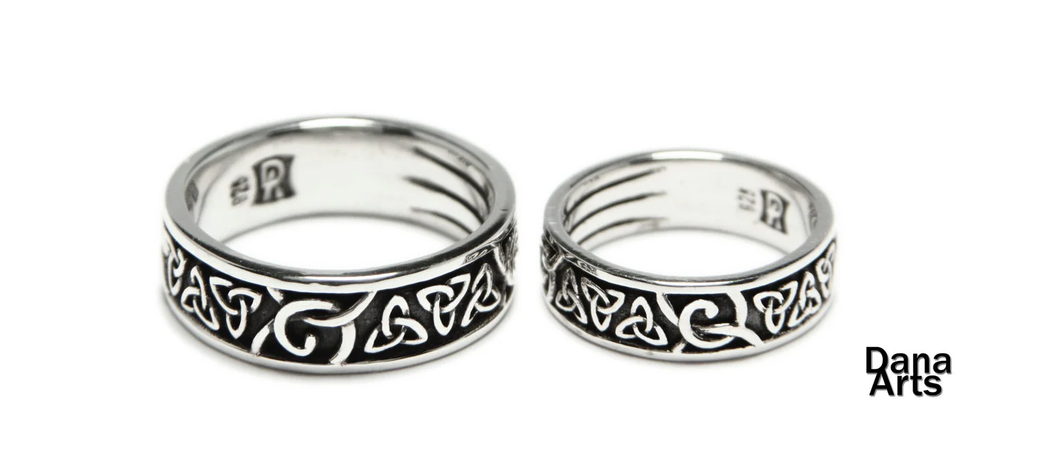 rings in silver with trinity knot symbol