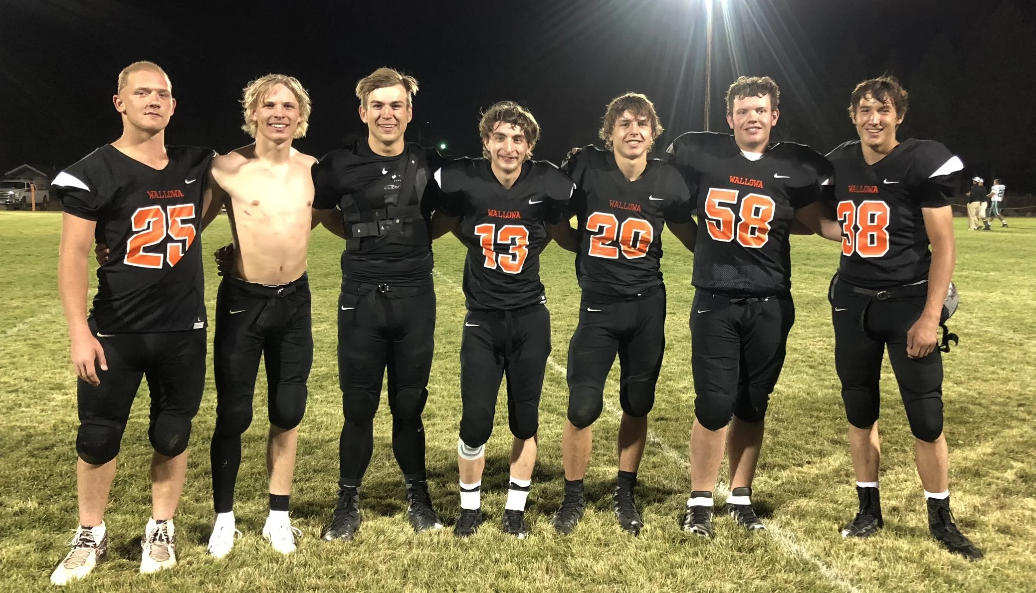 Wallowa football seniors - Gus with no shirt.