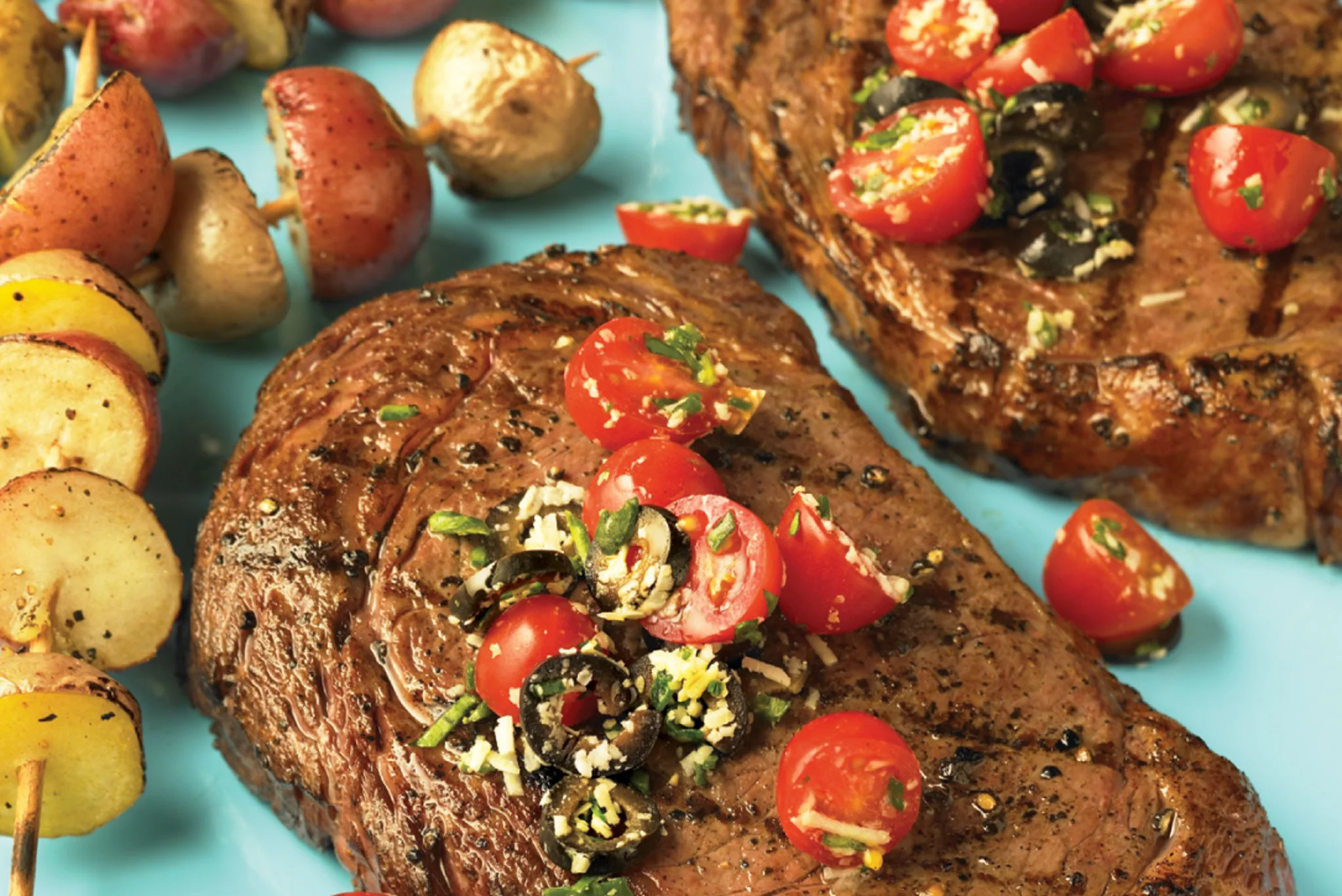ribeye-steaks-with-fresh-tomato-tapenade-horizontal.jpg