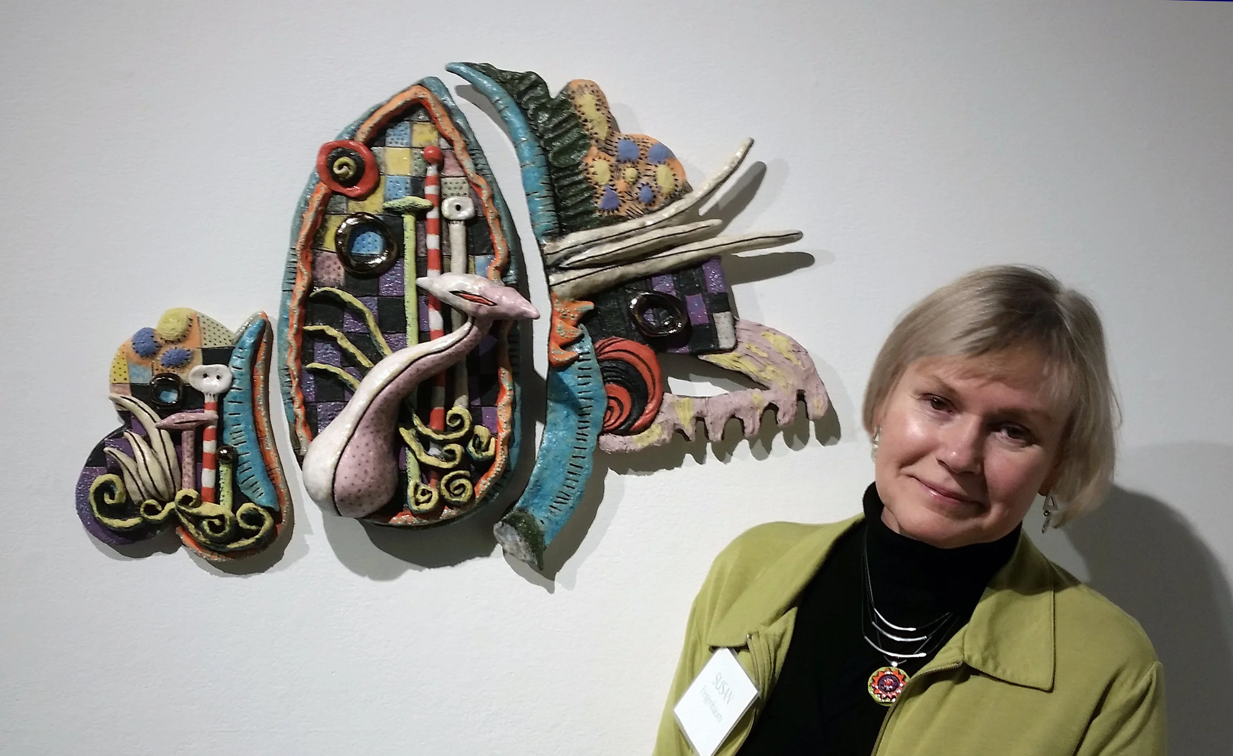 "Flight" ceramic wall sculpture, with the artist Susan Feigenbaum; Four Jerome Artists Opening Reception at Northern Clay Center, January 12, 2018.