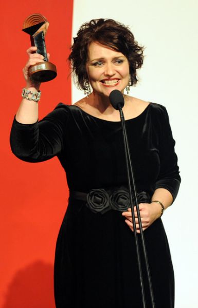 Emma with one of her many Helpmann Awards. Image via the SMH