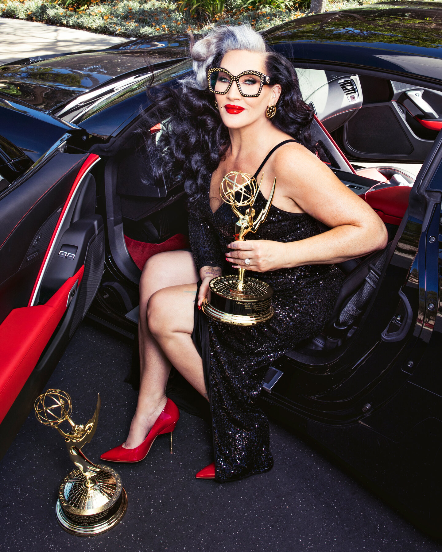 Michelle Visage photographed inside her Corvette.