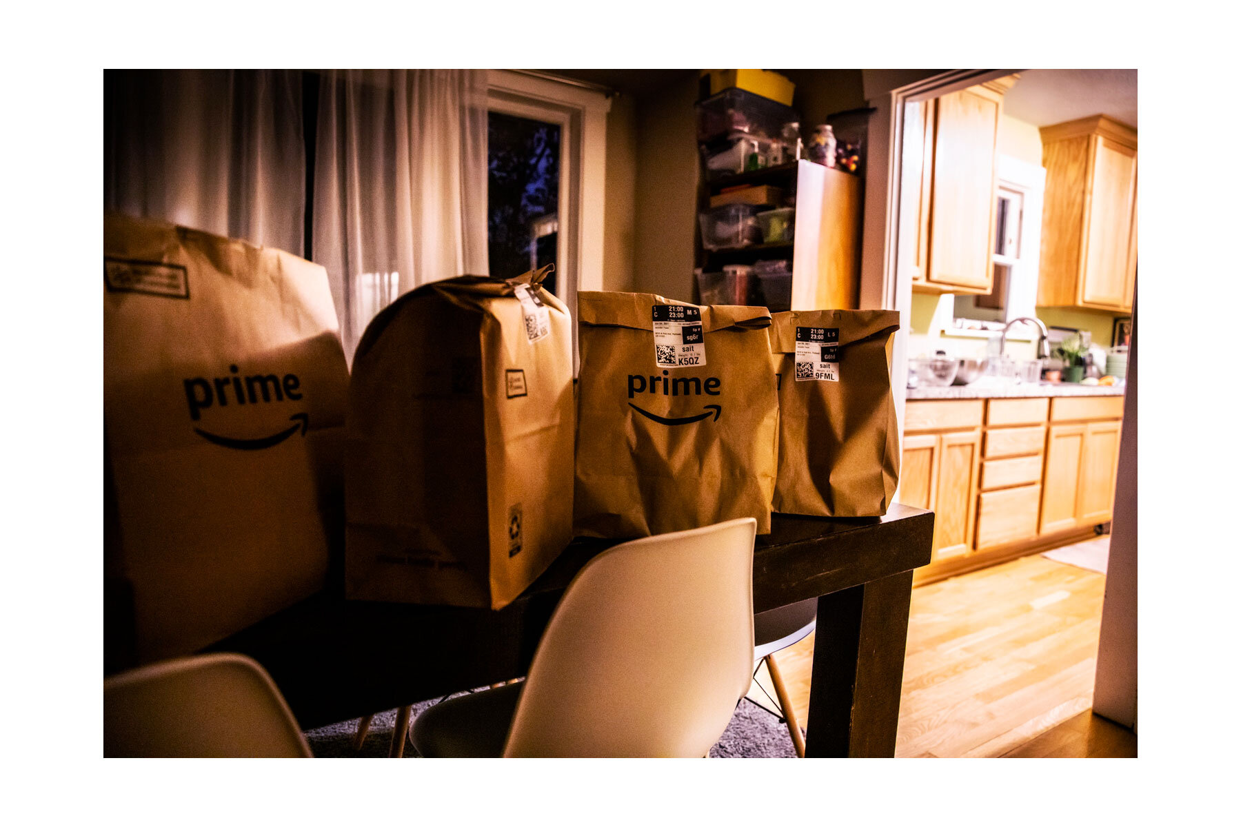 Groceries delivered at 9pm wait to be unpacked. 