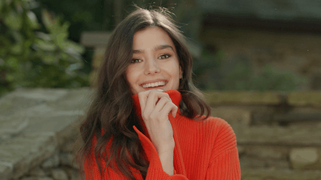 a group poses in front of some trees.gif