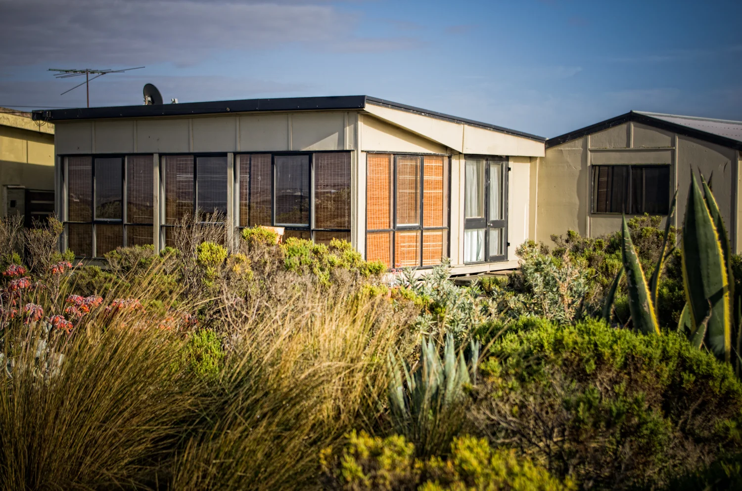 This site is of high social significance to the local community. There is a strong association with the fishing industry for at least 80 years. The huts represent a unique example of a vernacular fishing shack community close to a regional metropolis. It also has significance as the signature set of Mad Max, one of the most successful early Australian films that helped launch the industry to the international market. 