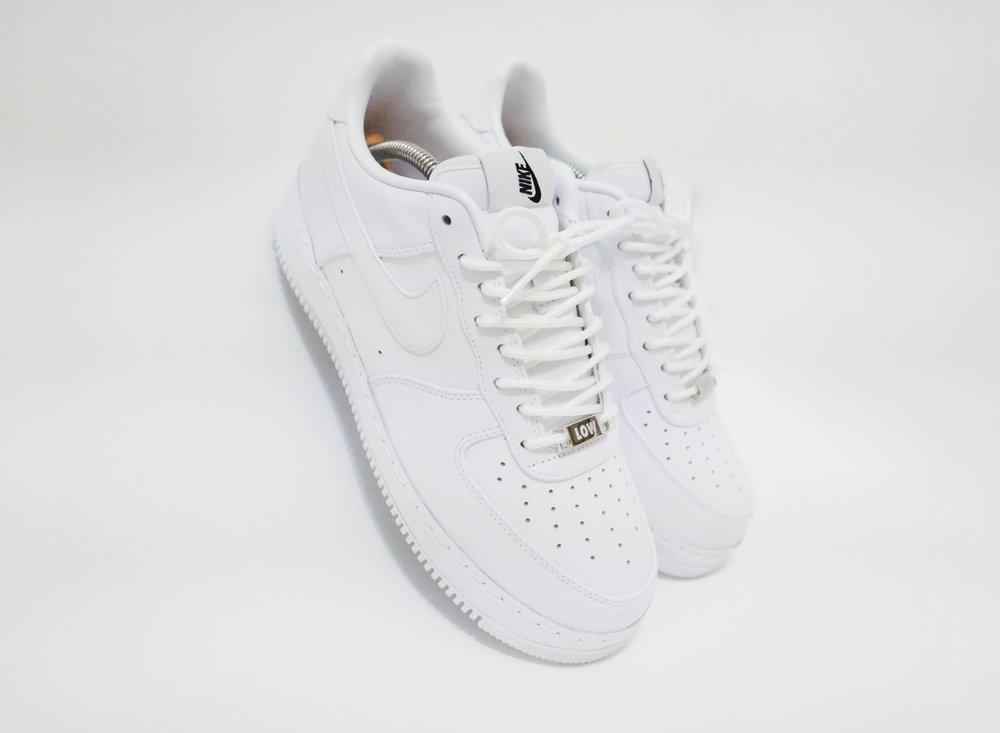 white uptowns low top