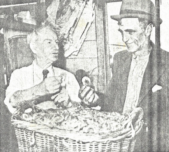 Hartley Spurr (left) inspecting a basket of prawns caught in the backwaters of Port Hunter by a local prawner.