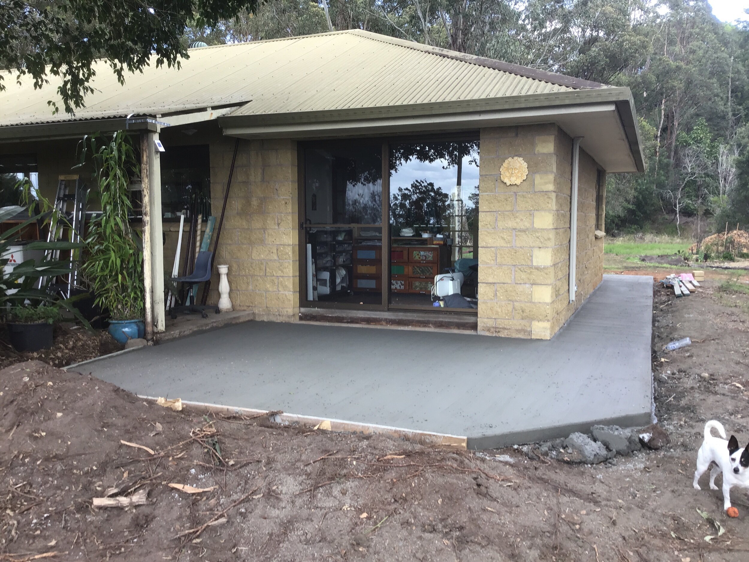 After the concreters came. I had to water the concrete for three days and clean up all the mess.
