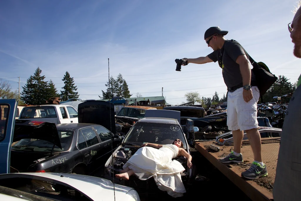 Just shooting a bride in the engine bay of an old car in a junk yard.