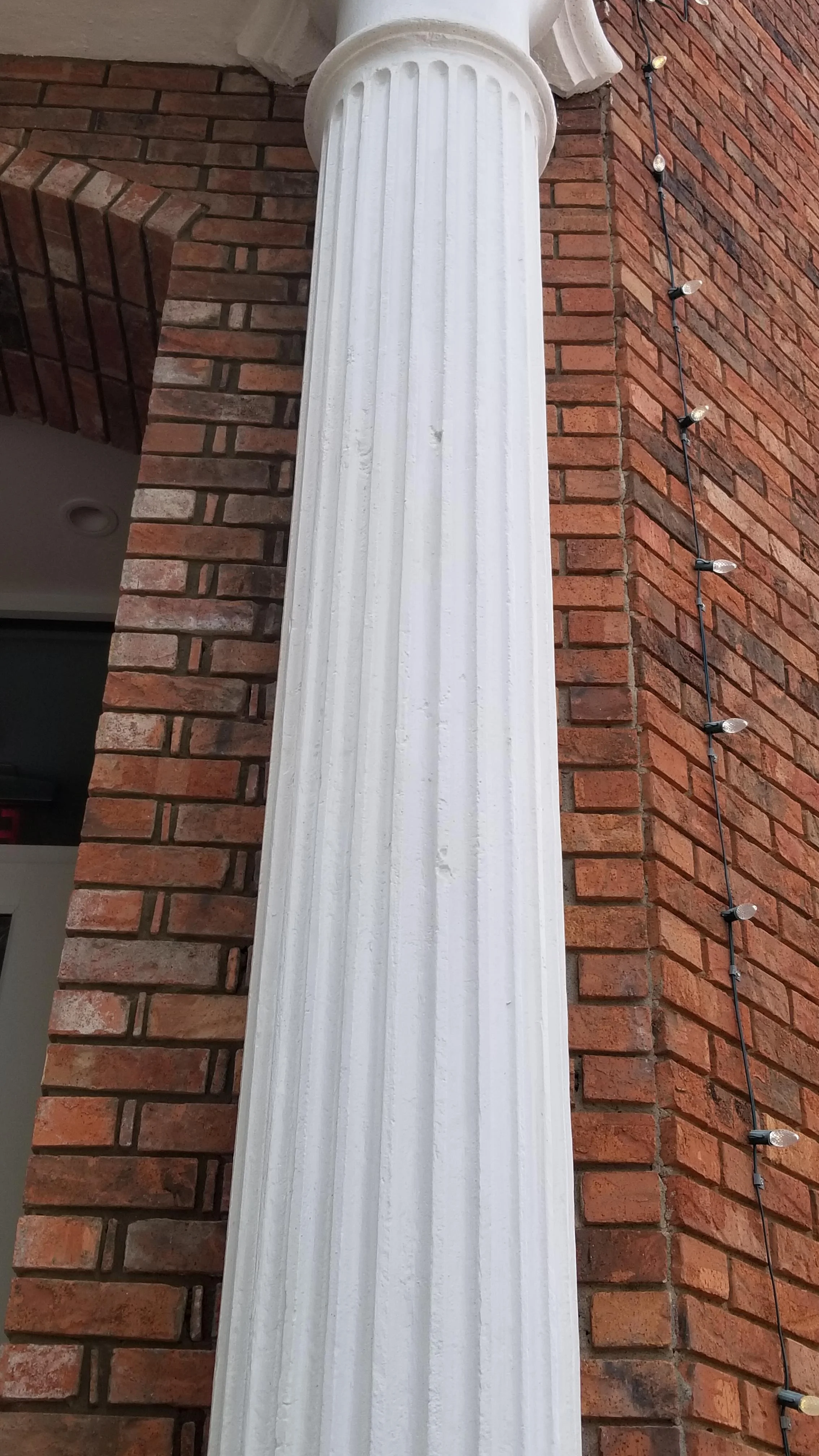The bullet nicked iron pillar outside of the old People's bank, now Fiamma restaurant. 