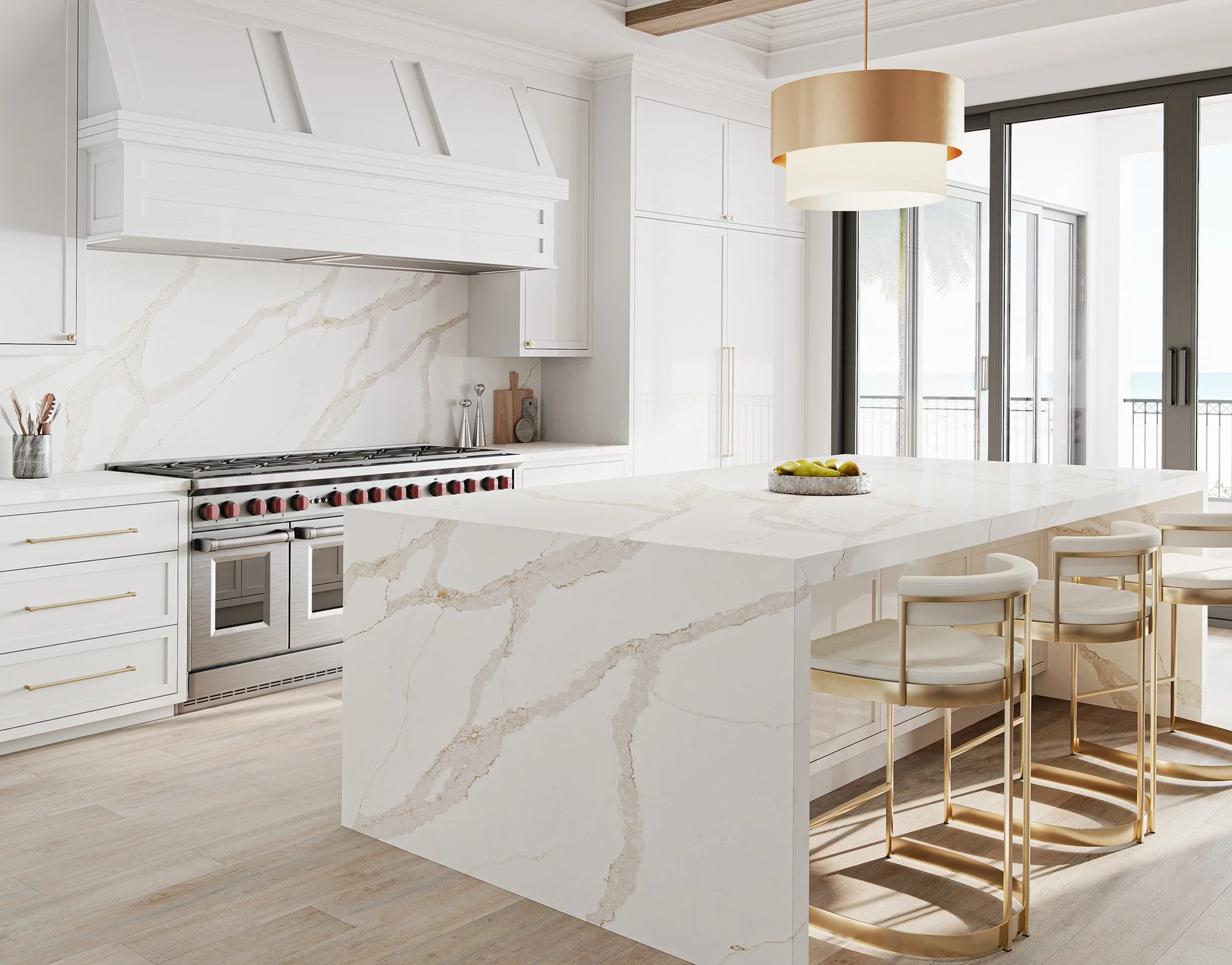 White and gold kitchen with wide-veined Stratus Calacatta Sancerre quartz island, counters, and full-height backsplash.