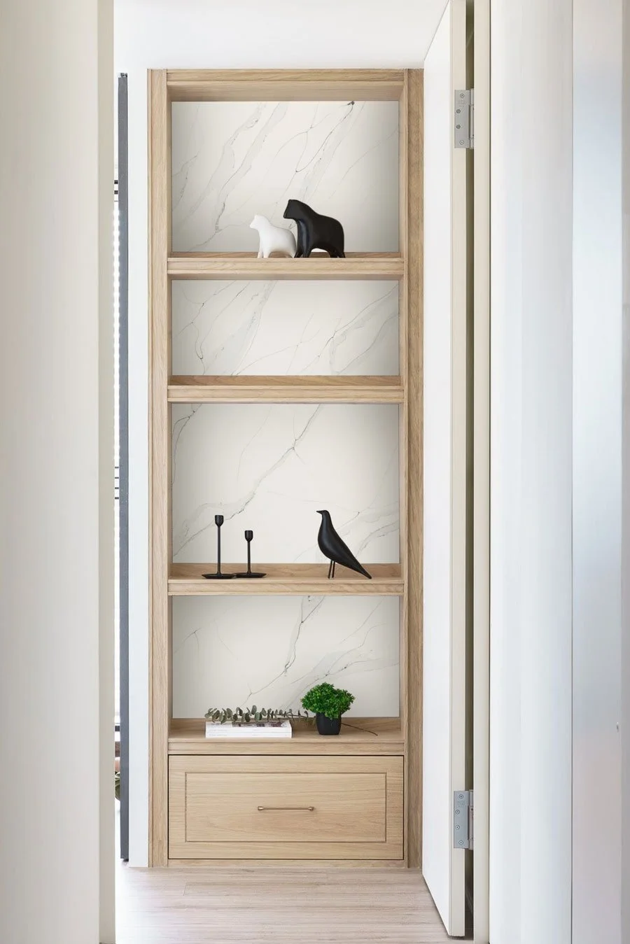 Stratus Tall open bookshelf with Unique Calacatta quartz wall cladding behind.