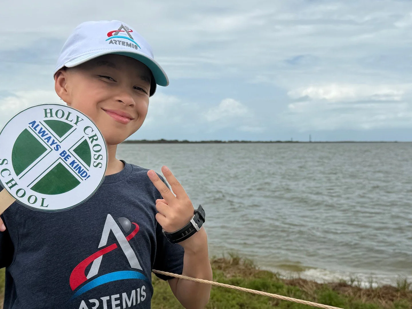 Holy Cross spirit&hellip;even at liftoff! 🚀💚 This 5th grader proudly represented our school while watching the Artemis II launch near the Kennedy Space Center! #ADWcommUNITY #ILoveHolyCross #ArtemisII