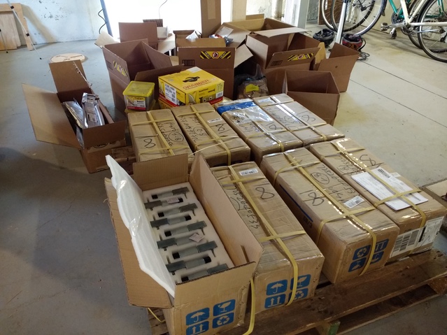 Motors and hardware accumulating in the basement.