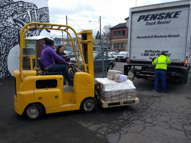 Unloading the brackets from the truck with a little help from some friends