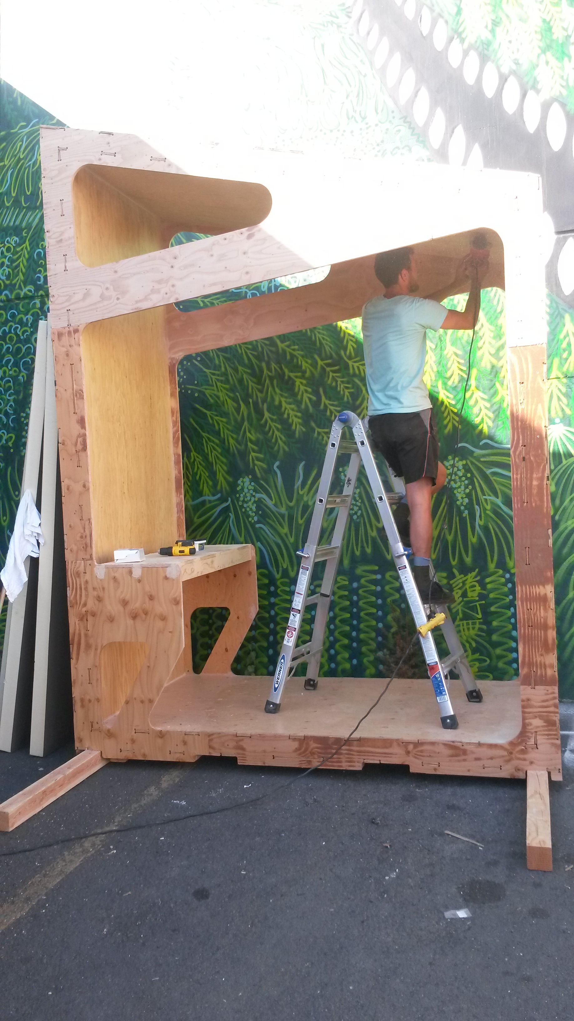 Noah from SERA Architects working hard to sand the inside of the pod. The goal is to have this segment completely finished by Sunday!