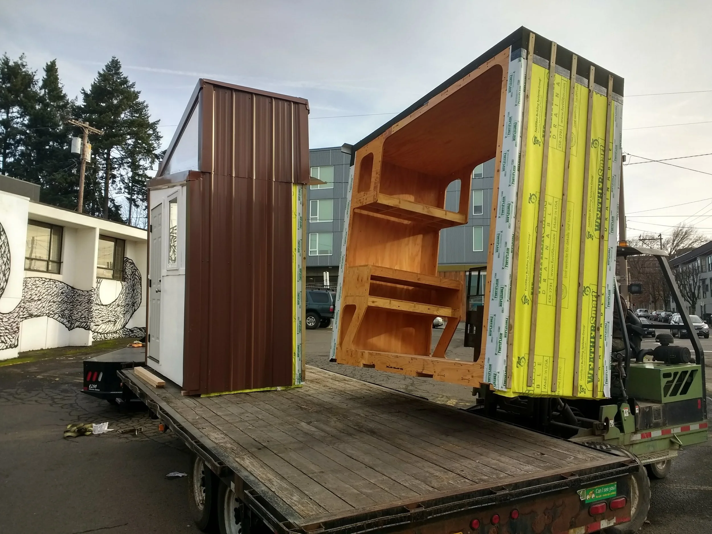 Loading the POD onto the flatbed truck early in the morning before the parking lot could fill up