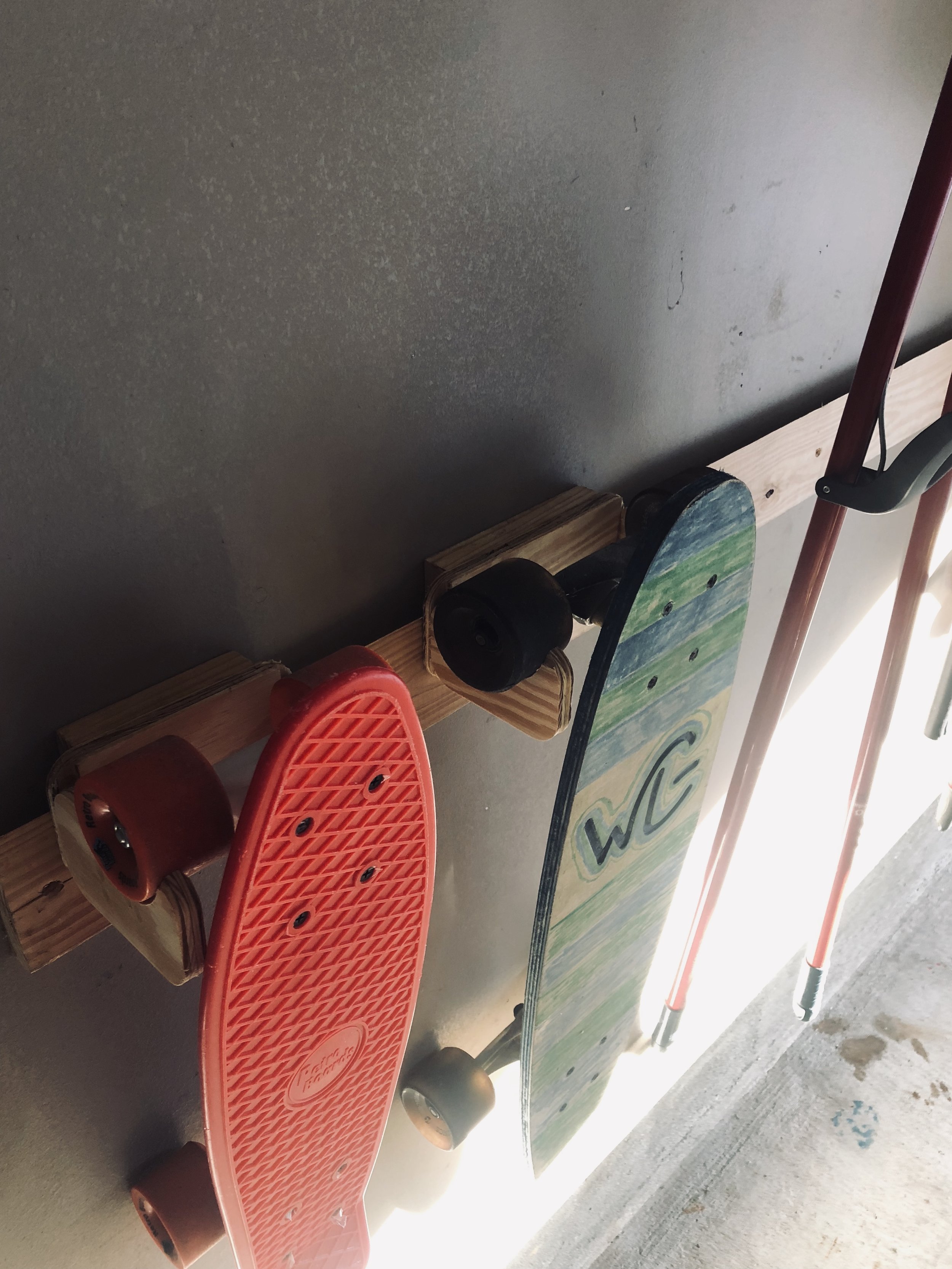 clintloggins skateboard holder.jpeg