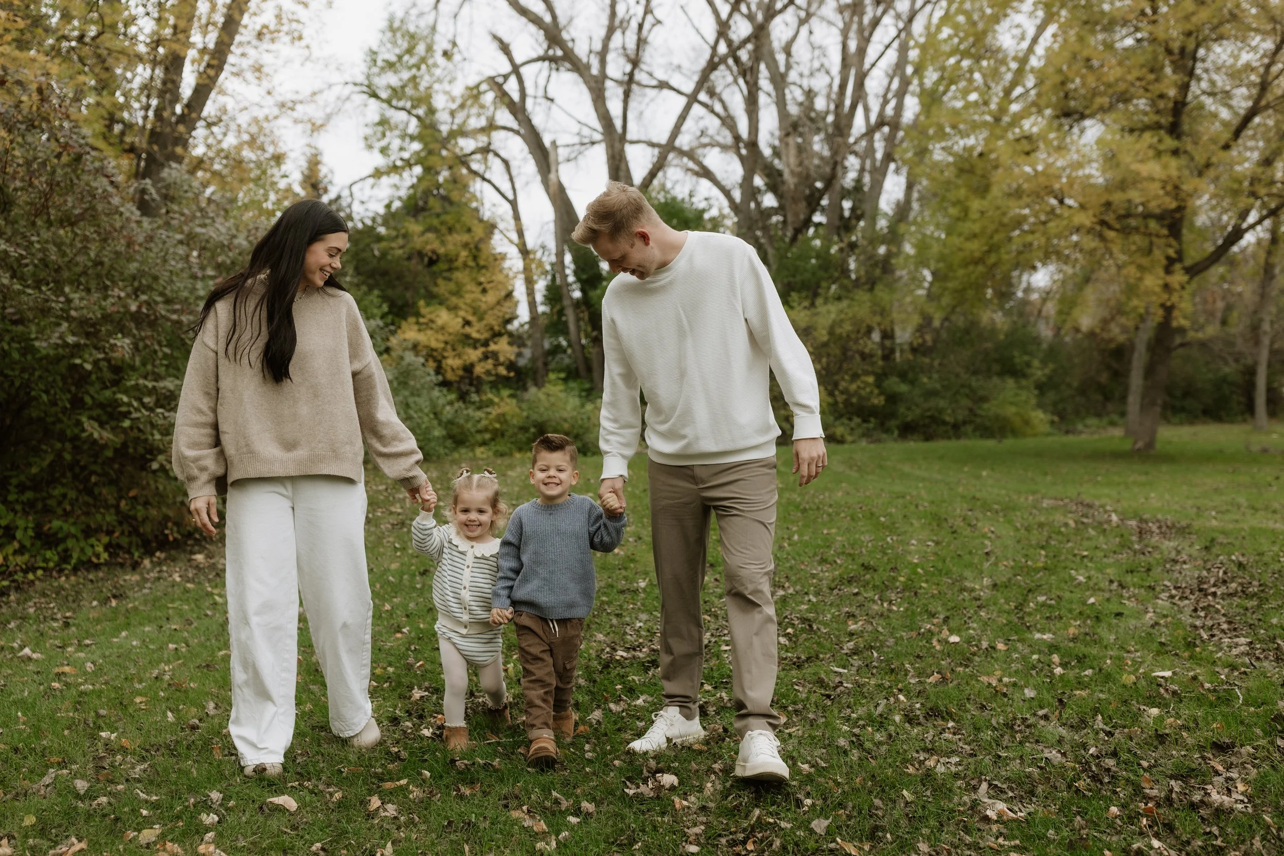 cozy family photos in the fall leaves