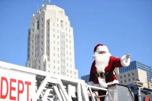 Santa greets boys and girls along Penn Street during the 2016 Reading Holiday Parade. Photo by Lauren Little, Reading Eagle