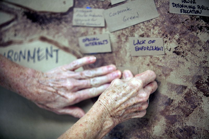 Elder Hands placing Trunk oahu IF.jpg