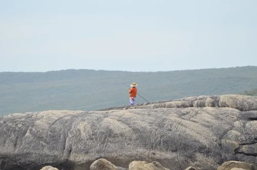 australia fisherman landscape red rocks ocean brittany byrne.jpg