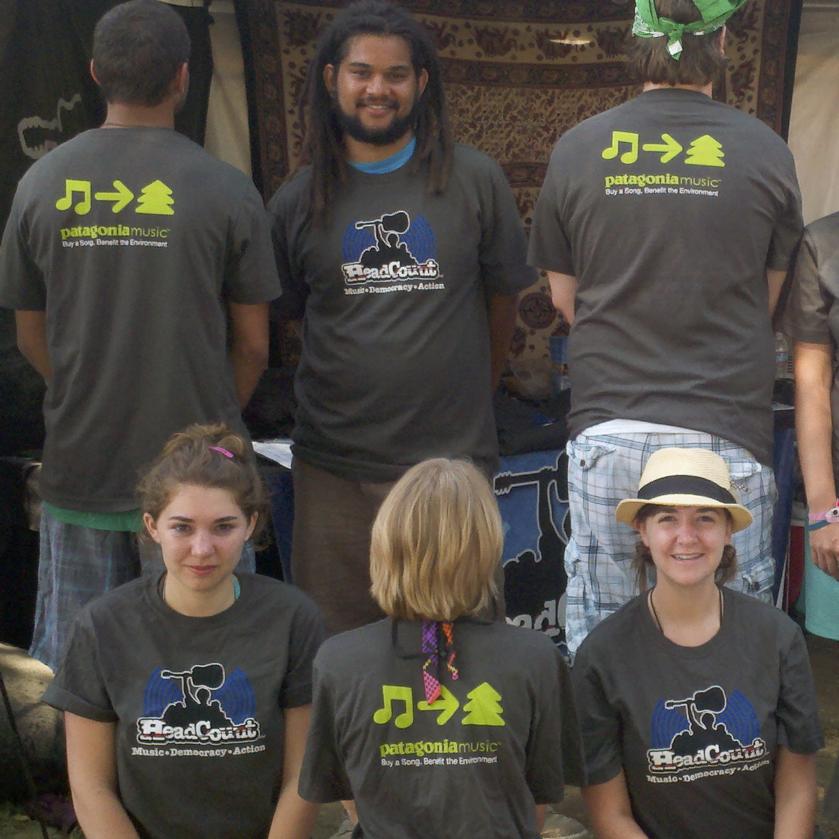 Headcount.org volunteers take a break from registering voters at a concert to show off their PMC t-shirts for us.